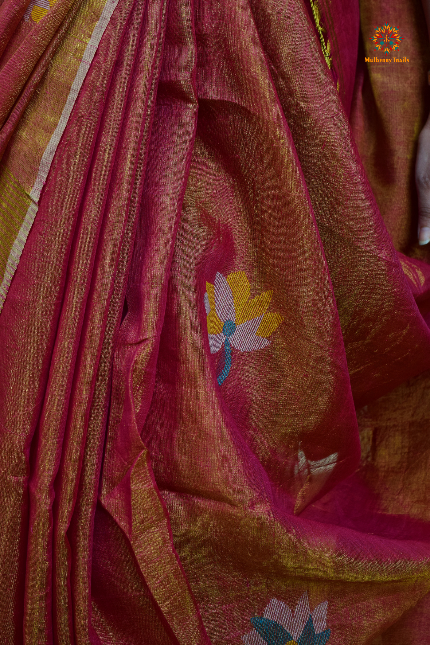 This image features an Elegant tissue saree featuring intricate handwoven Jamdani lotus motifs, with a lightweight, shimmery fabric that drapes beautifully, perfect for festive and special occasions. Party wear , diwali theme.