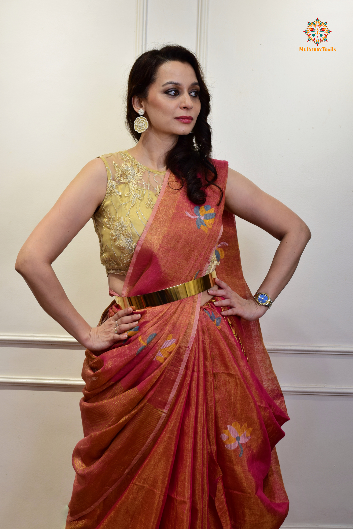 This image features an Elegant tissue saree featuring intricate handwoven Jamdani lotus motifs, with a lightweight, shimmery fabric that drapes beautifully, perfect for festive and special occasions. Party wear , diwali theme.