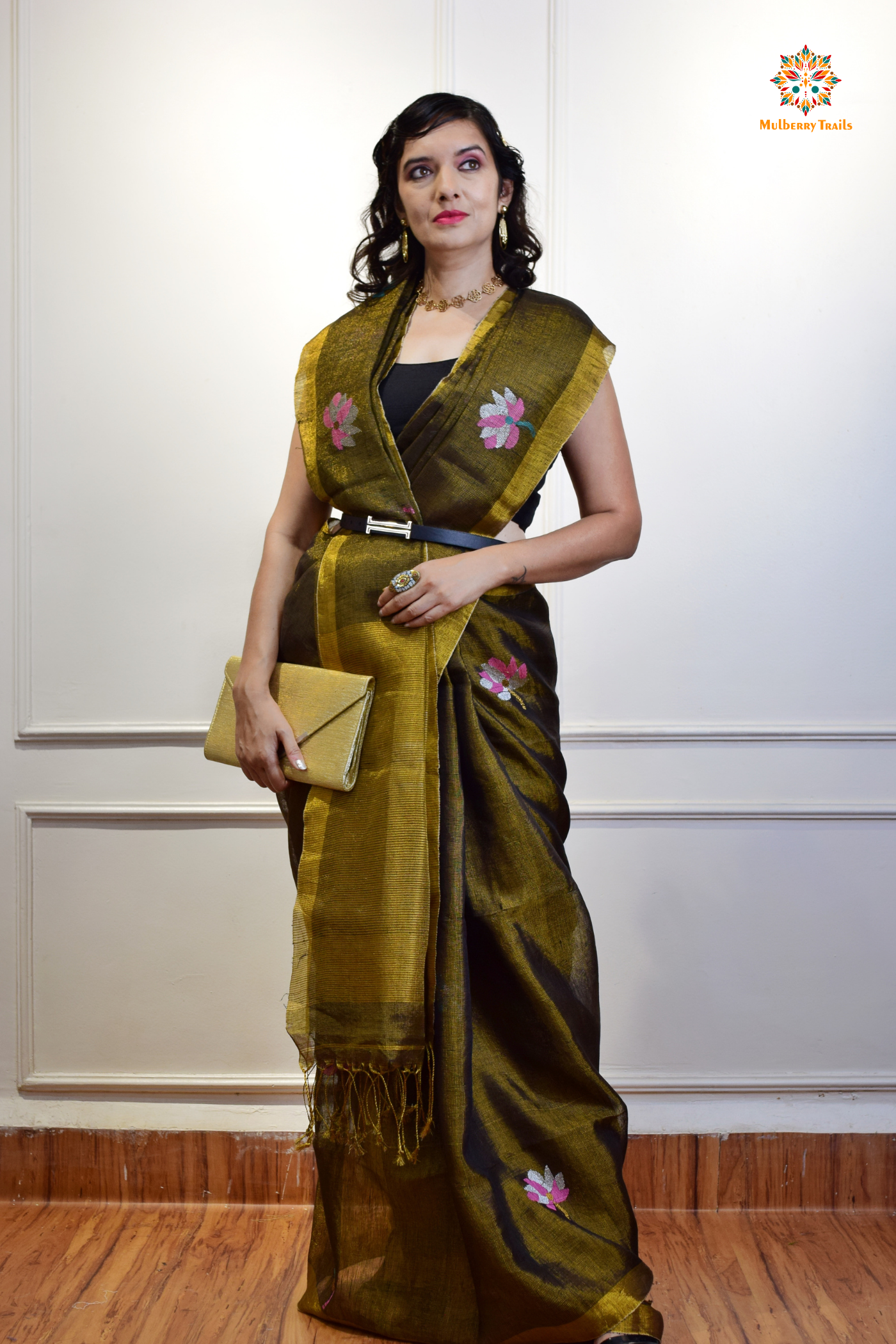 This image features an Elegant tissue saree featuring intricate handwoven Jamdani lotus motifs, with a lightweight, shimmery fabric that drapes beautifully, perfect for festive and special occasions. Party wear , diwali theme.