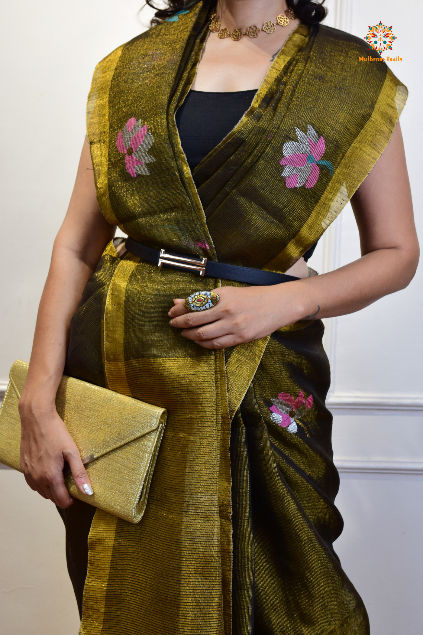 This image features an Elegant tissue saree featuring intricate handwoven Jamdani lotus motifs, with a lightweight, shimmery fabric that drapes beautifully, perfect for festive and special occasions. Party wear , diwali theme.