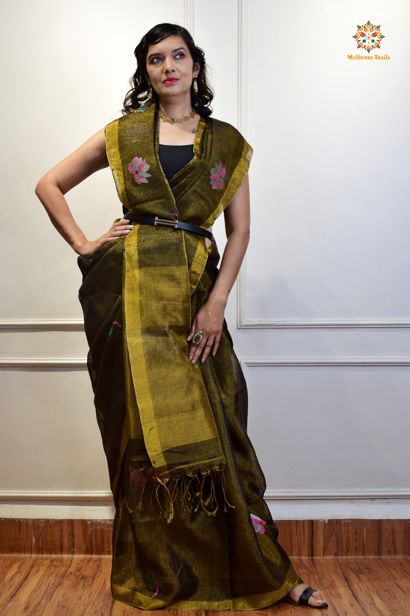 This image features an Elegant tissue saree featuring intricate handwoven Jamdani lotus motifs, with a lightweight, shimmery fabric that drapes beautifully, perfect for festive and special occasions. Party wear , diwali theme.