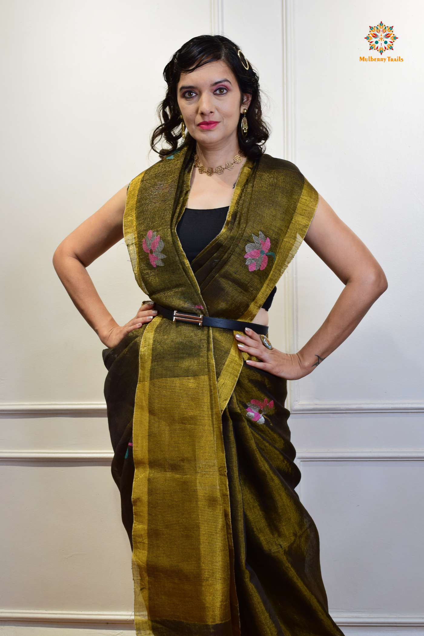 This image features an Elegant tissue saree featuring intricate handwoven Jamdani lotus motifs, with a lightweight, shimmery fabric that drapes beautifully, perfect for festive and special occasions. Party wear , diwali theme.