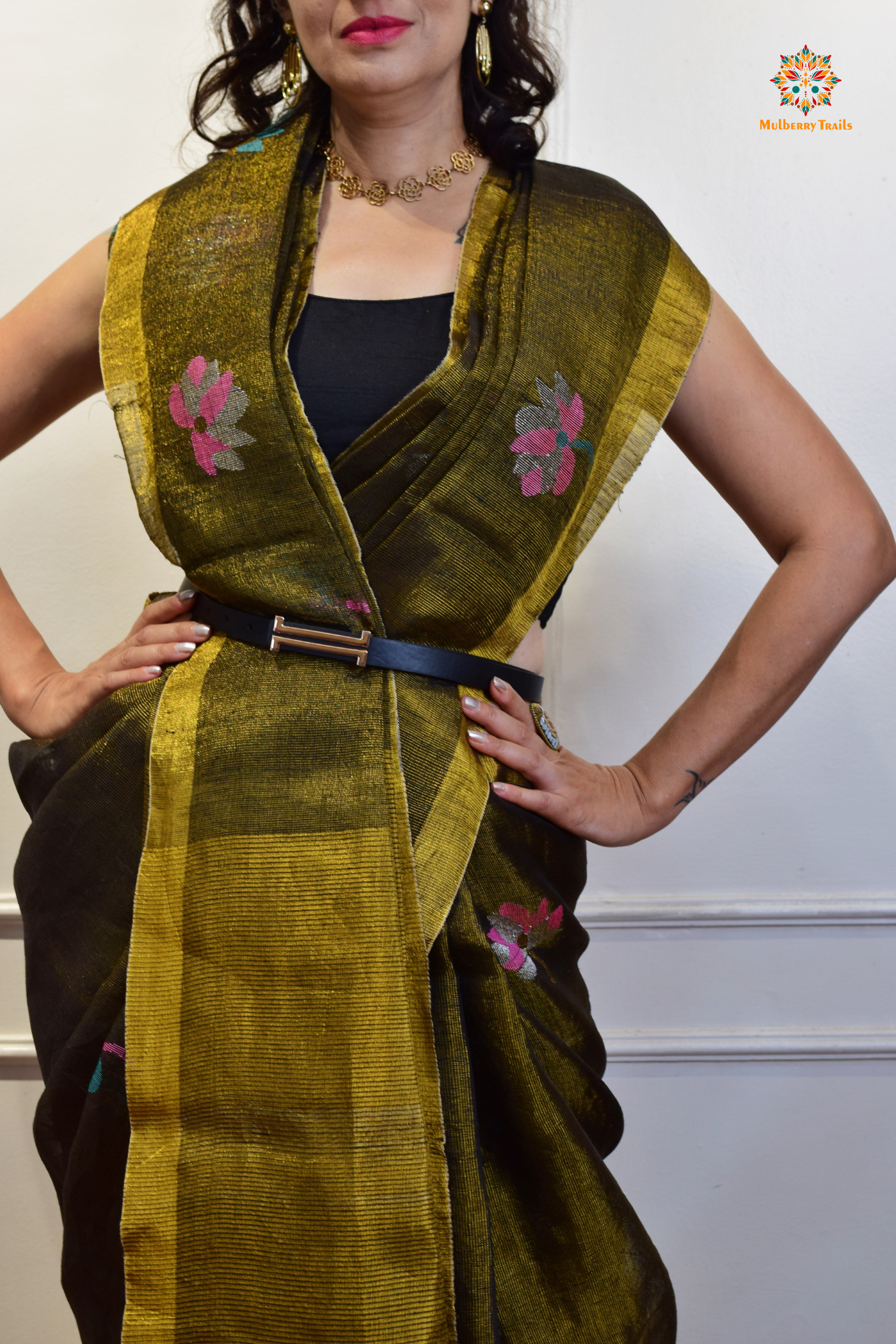 This image features an Elegant tissue saree featuring intricate handwoven Jamdani lotus motifs, with a lightweight, shimmery fabric that drapes beautifully, perfect for festive and special occasions. Party wear , diwali theme.