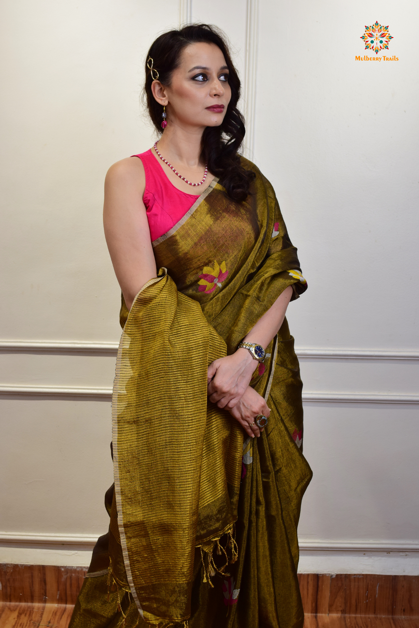 This image features an Elegant tissue saree featuring intricate handwoven Jamdani lotus motifs, with a lightweight, shimmery fabric that drapes beautifully, perfect for festive and special occasions. Party wear , diwali theme.