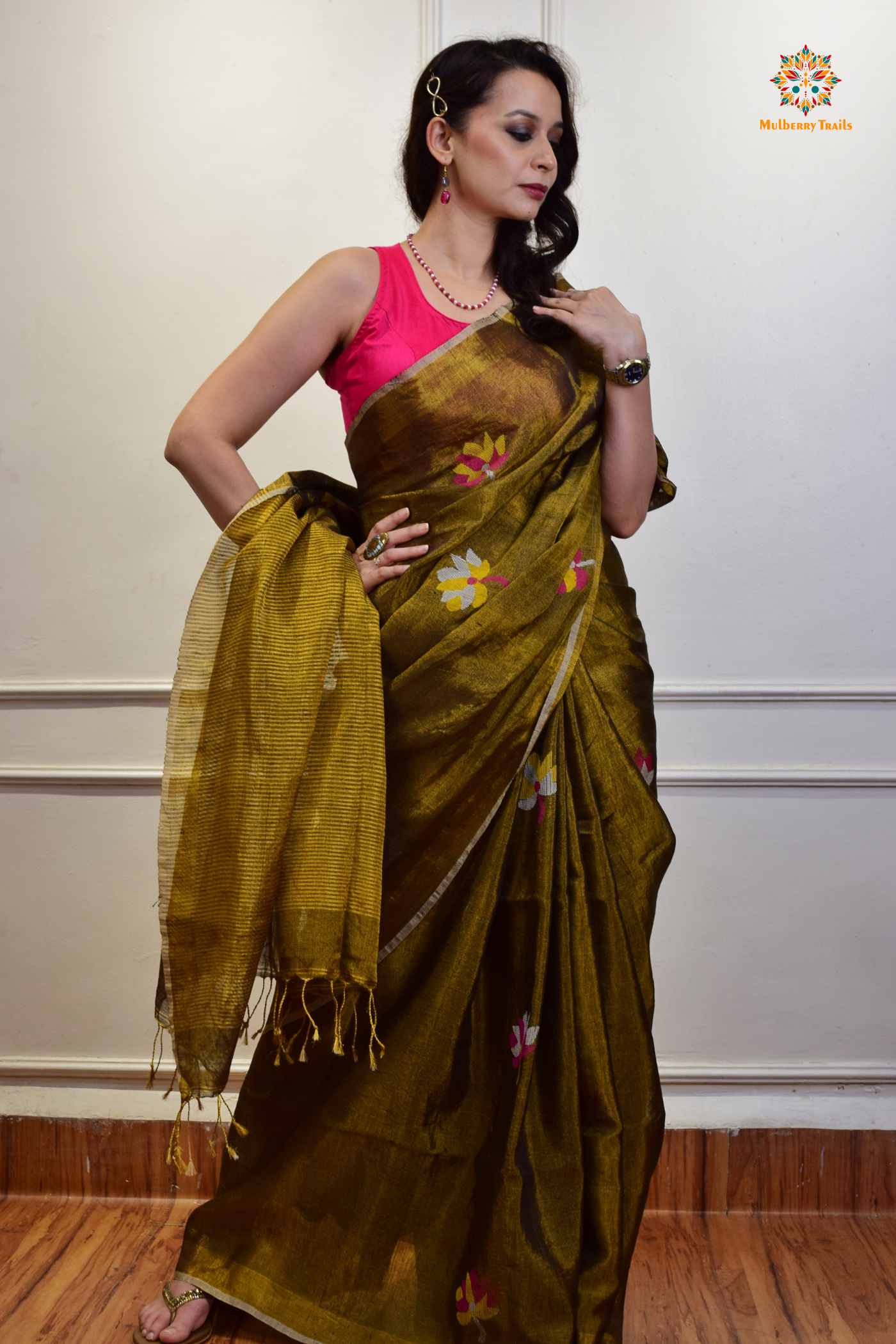 This image features an Elegant tissue saree featuring intricate handwoven Jamdani lotus motifs, with a lightweight, shimmery fabric that drapes beautifully, perfect for festive and special occasions. Party wear , diwali theme.