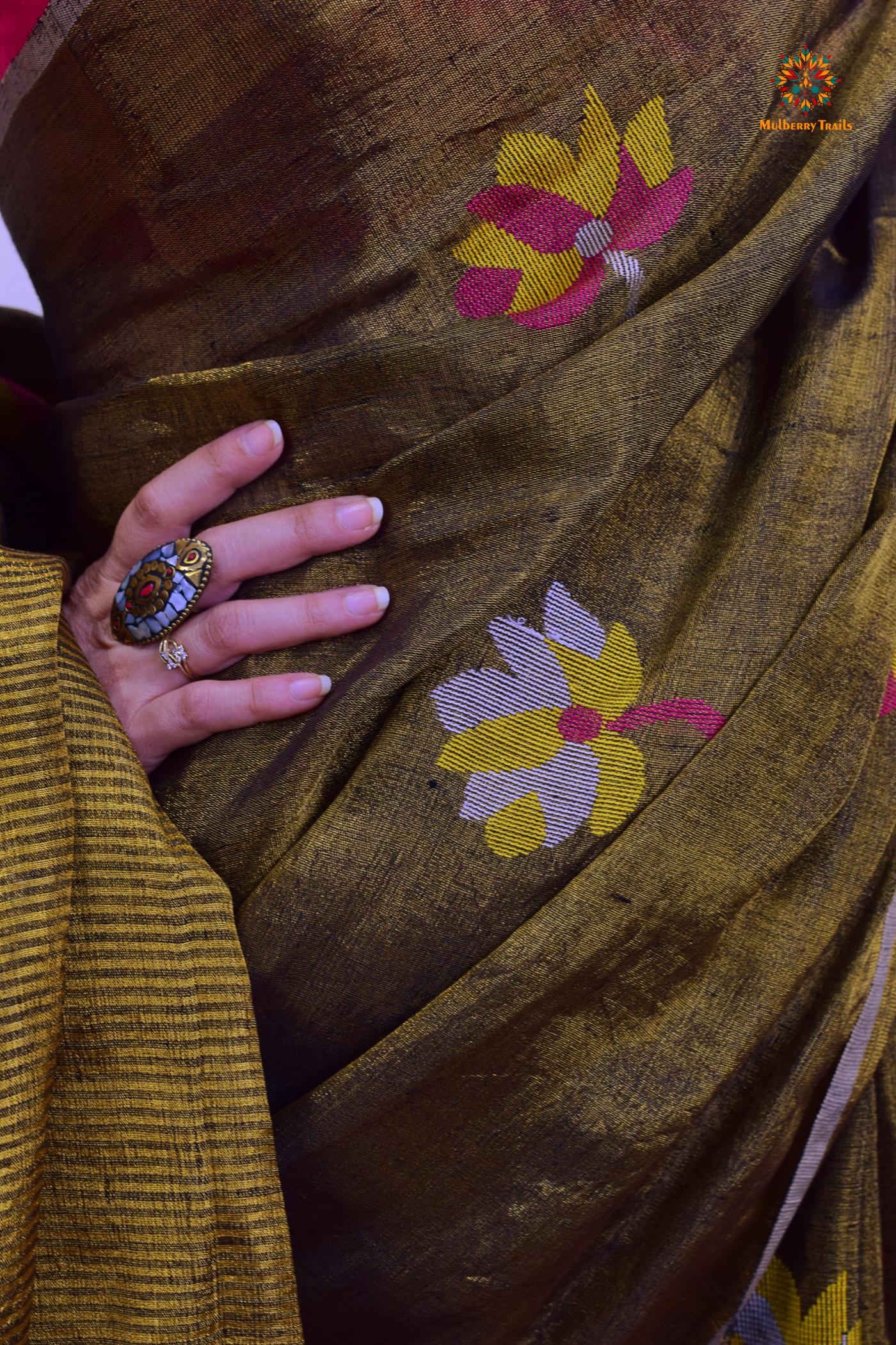 This image features an Elegant tissue saree featuring intricate handwoven Jamdani lotus motifs, with a lightweight, shimmery fabric that drapes beautifully, perfect for festive and special occasions. Party wear , diwali theme.