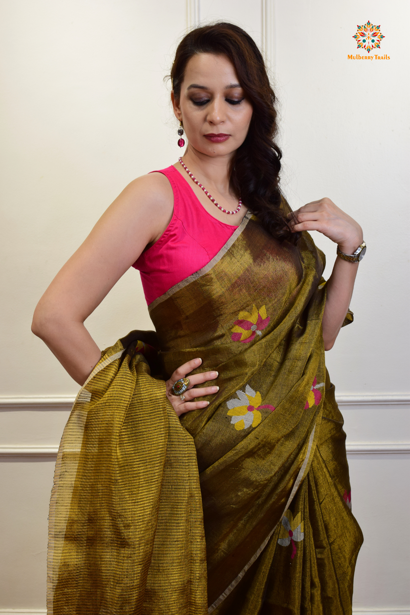 This image features an Elegant tissue saree featuring intricate handwoven Jamdani lotus motifs, with a lightweight, shimmery fabric that drapes beautifully, perfect for festive and special occasions. Party wear , diwali theme.