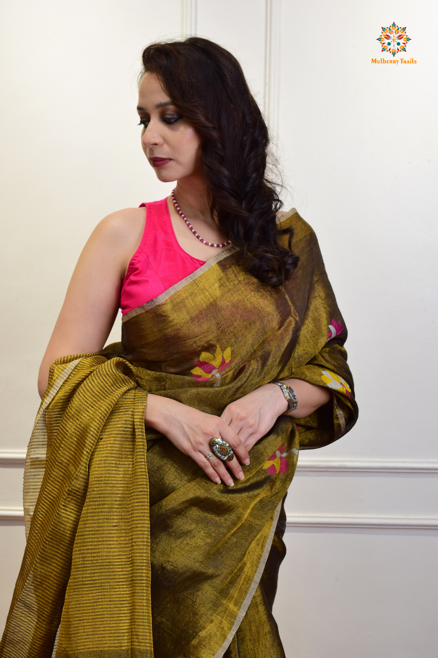 This image features an Elegant tissue saree featuring intricate handwoven Jamdani lotus motifs, with a lightweight, shimmery fabric that drapes beautifully, perfect for festive and special occasions. Party wear , diwali theme.