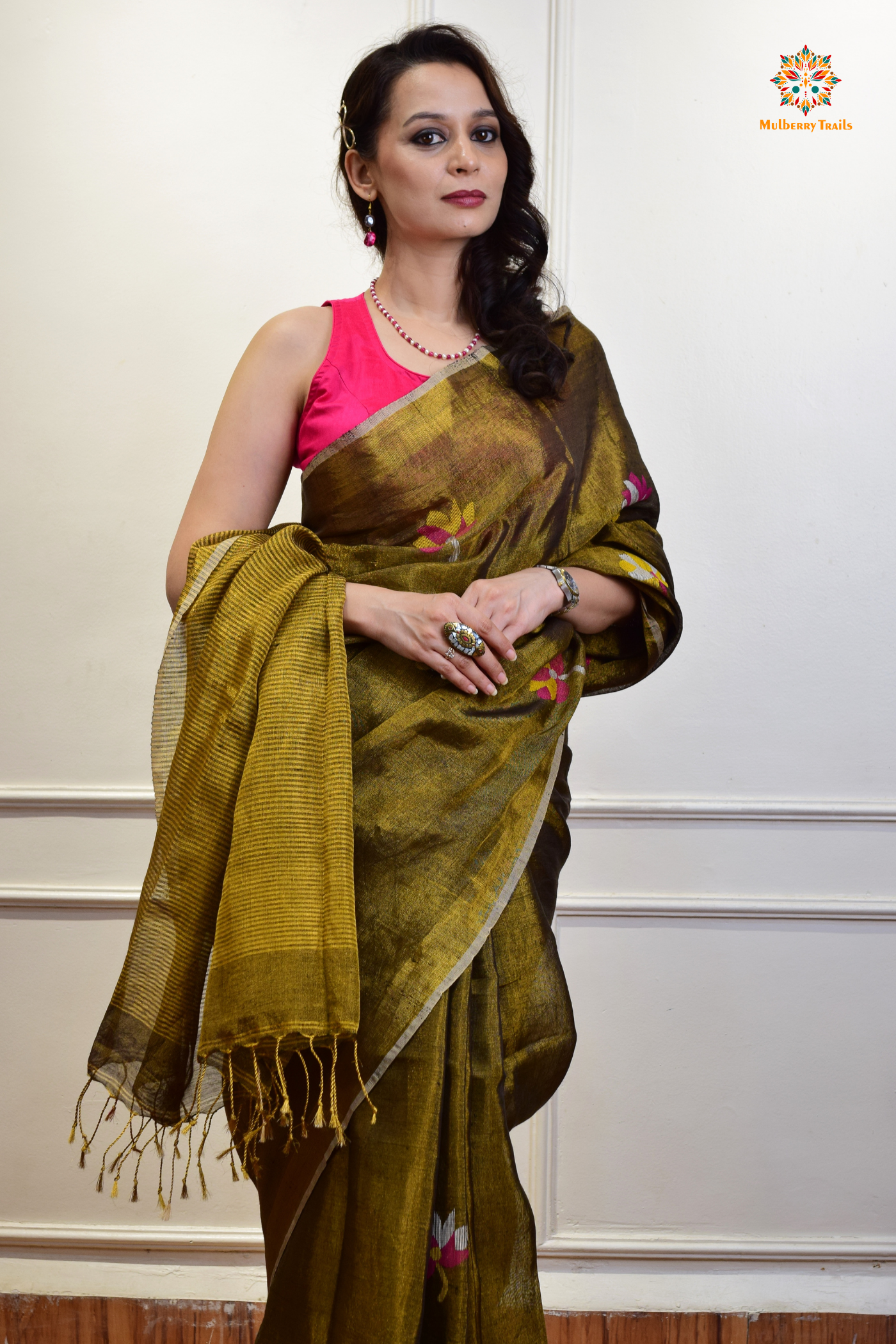 This image features an Elegant tissue saree featuring intricate handwoven Jamdani lotus motifs, with a lightweight, shimmery fabric that drapes beautifully, perfect for festive and special occasions. Party wear , diwali theme.