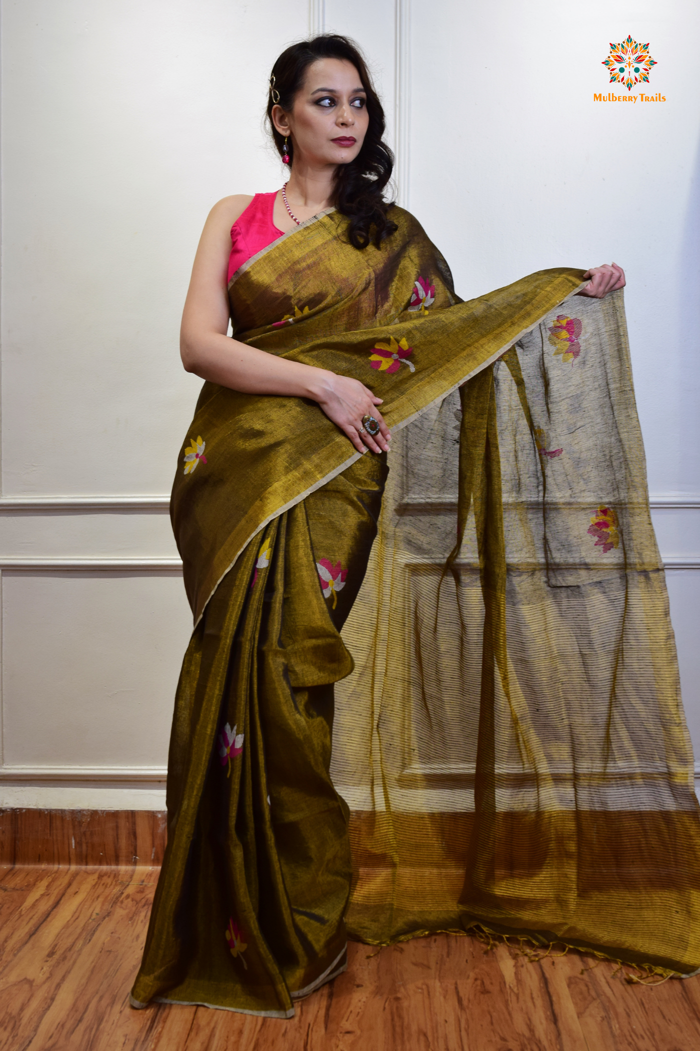 This image features an Elegant tissue saree featuring intricate handwoven Jamdani lotus motifs, with a lightweight, shimmery fabric that drapes beautifully, perfect for festive and special occasions. Party wear , diwali theme.