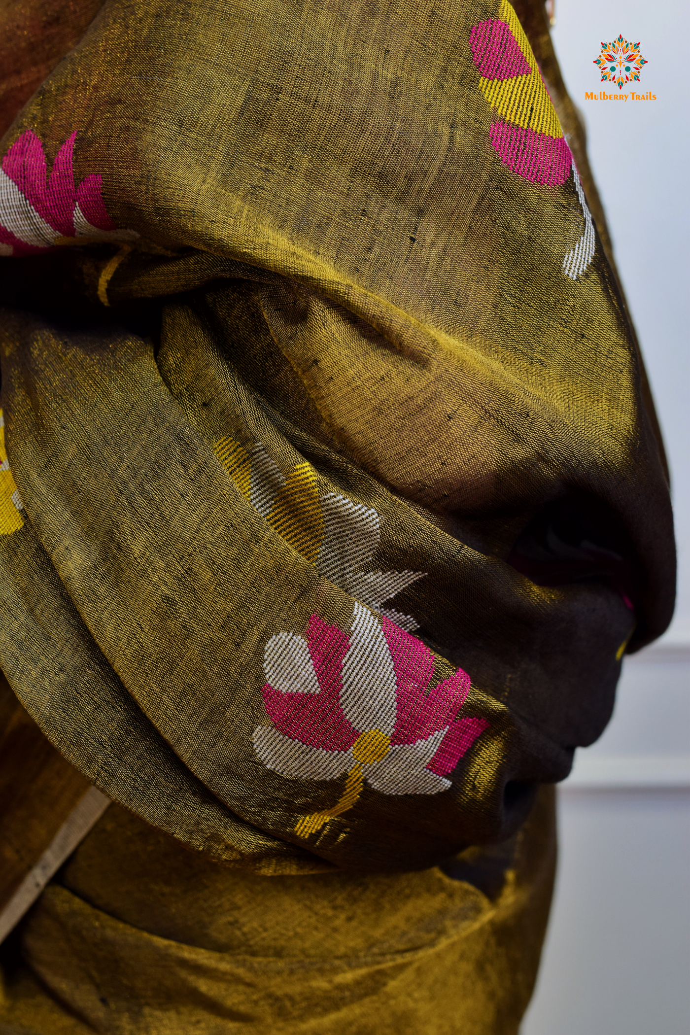 This image features an Elegant tissue saree featuring intricate handwoven Jamdani lotus motifs, with a lightweight, shimmery fabric that drapes beautifully, perfect for festive and special occasions. Party wear , diwali theme.