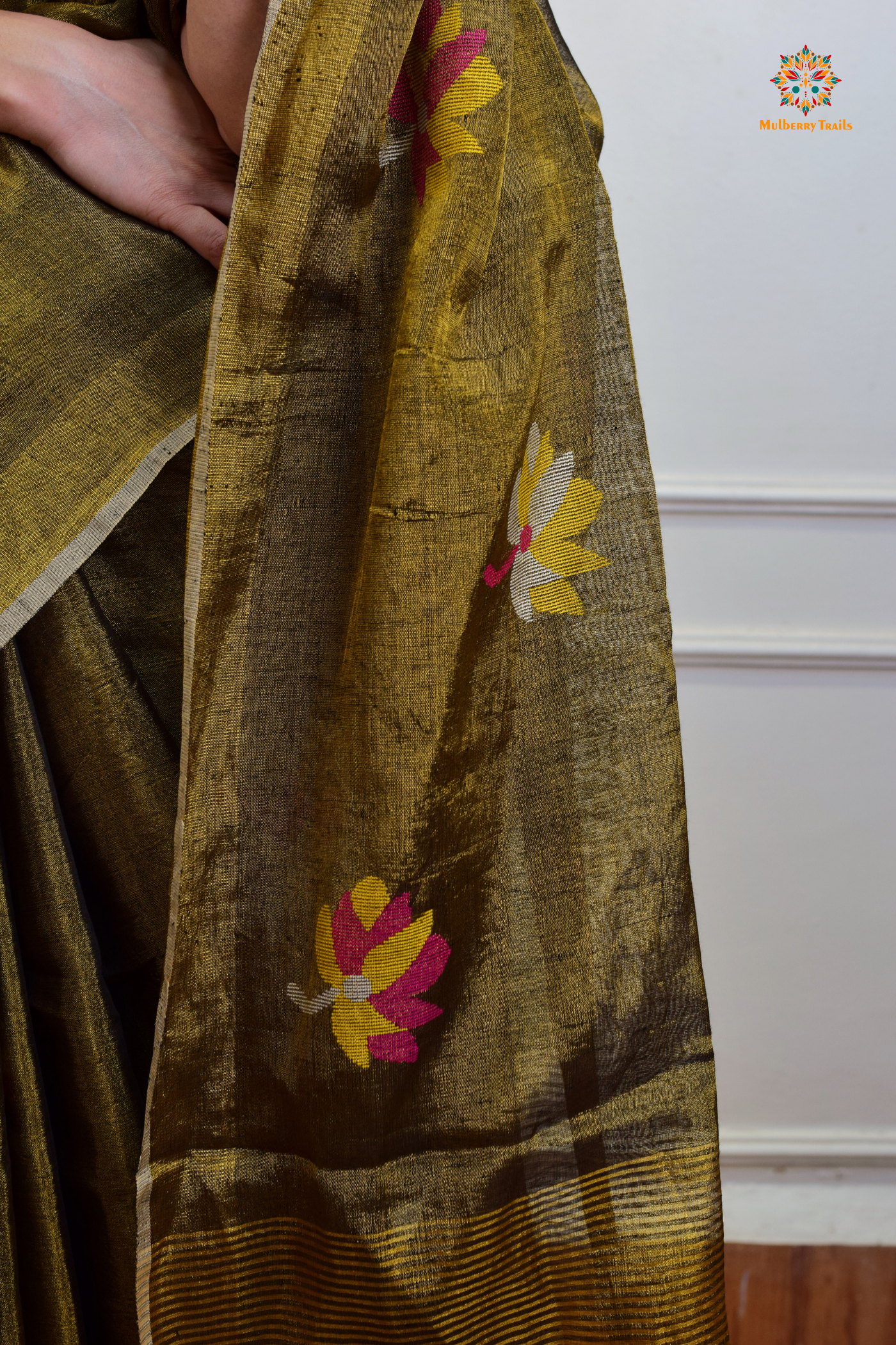 This image features an Elegant tissue saree featuring intricate handwoven Jamdani lotus motifs, with a lightweight, shimmery fabric that drapes beautifully, perfect for festive and special occasions. Party wear , diwali theme.