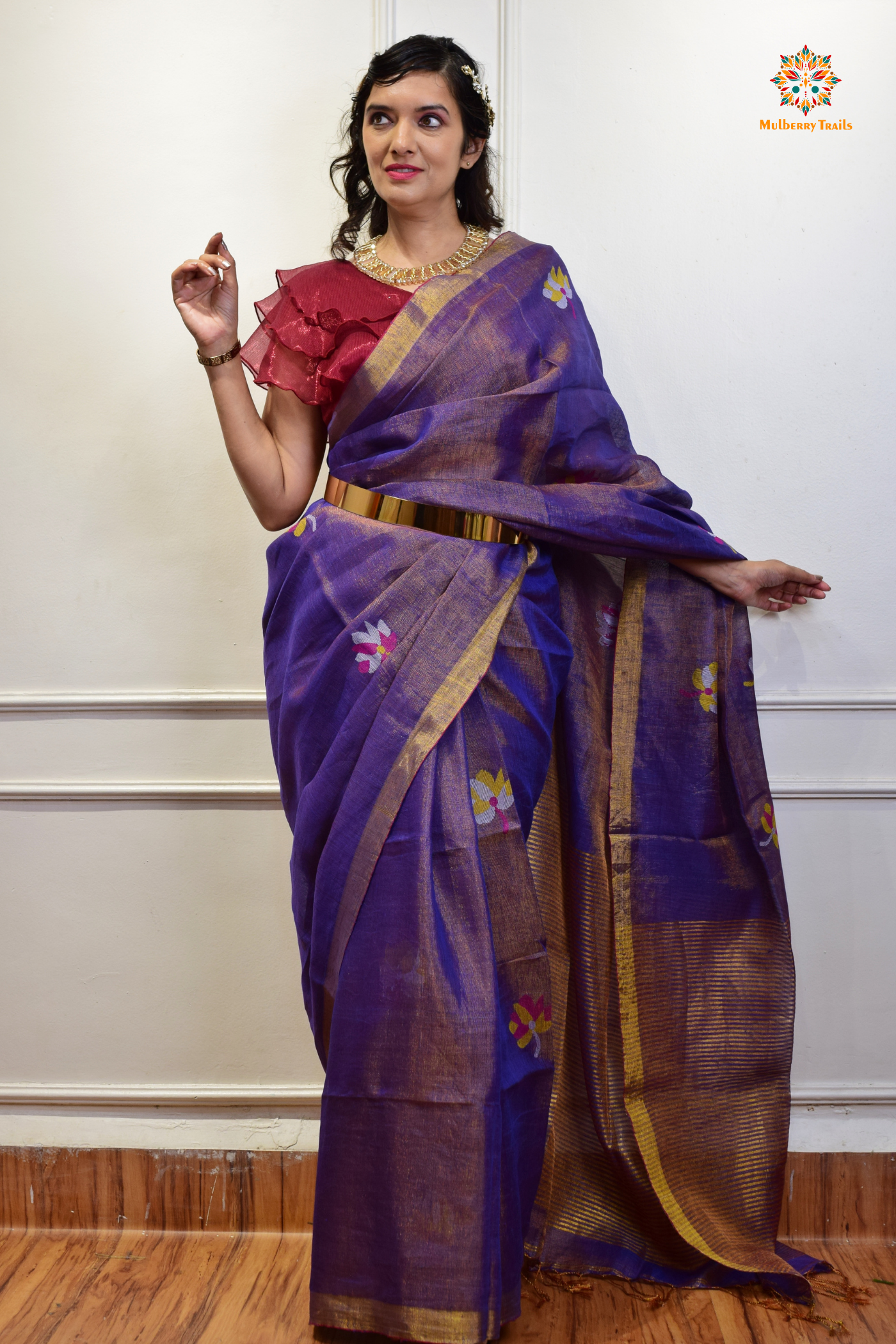This image features an Elegant tissue saree featuring intricate handwoven Jamdani lotus motifs, with a lightweight, shimmery fabric that drapes beautifully, perfect for festive and special occasions. Party wear , diwali theme.