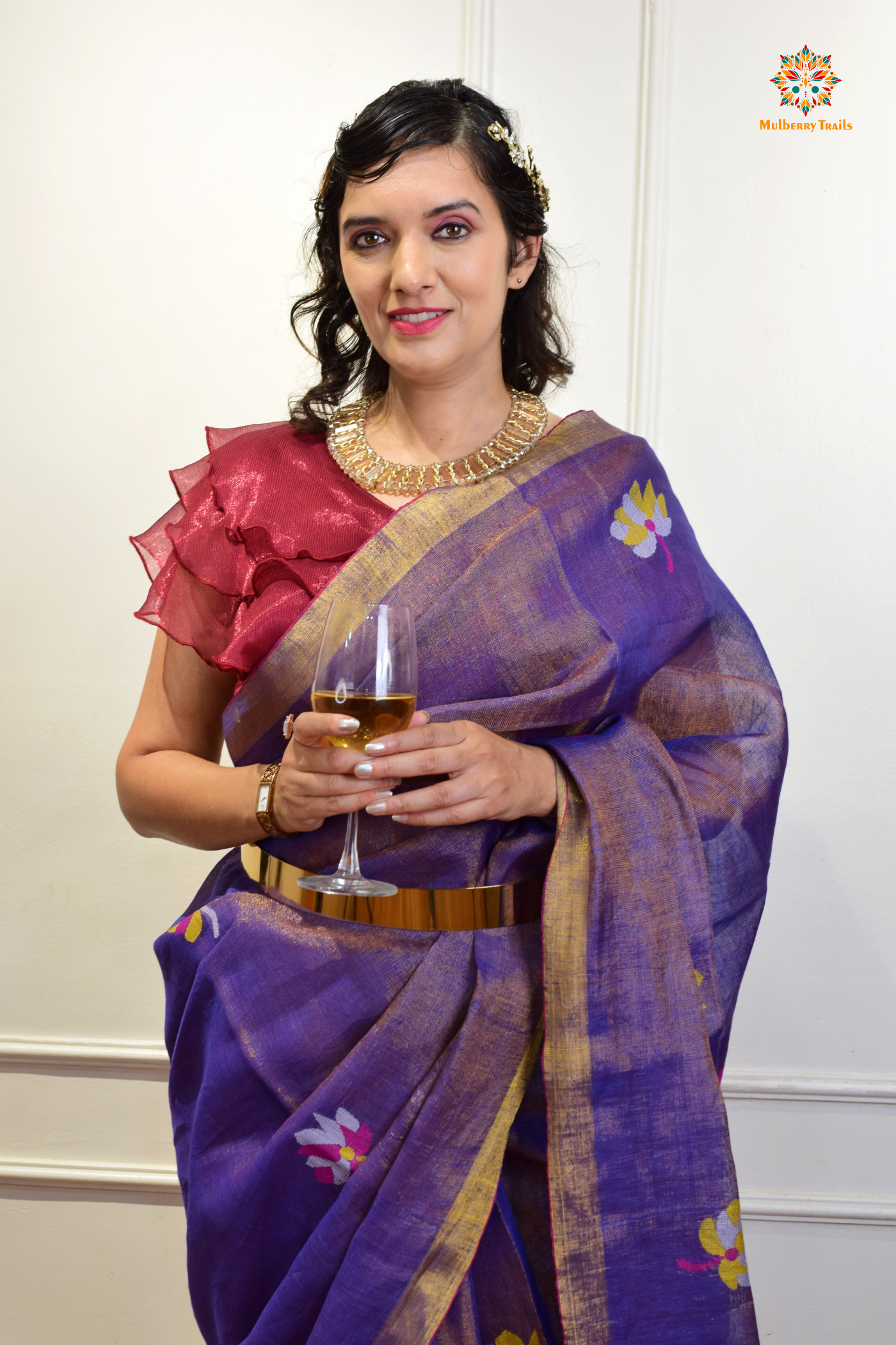 This image features an Elegant tissue saree featuring intricate handwoven Jamdani lotus motifs, with a lightweight, shimmery fabric that drapes beautifully, perfect for festive and special occasions. Party wear , diwali theme.