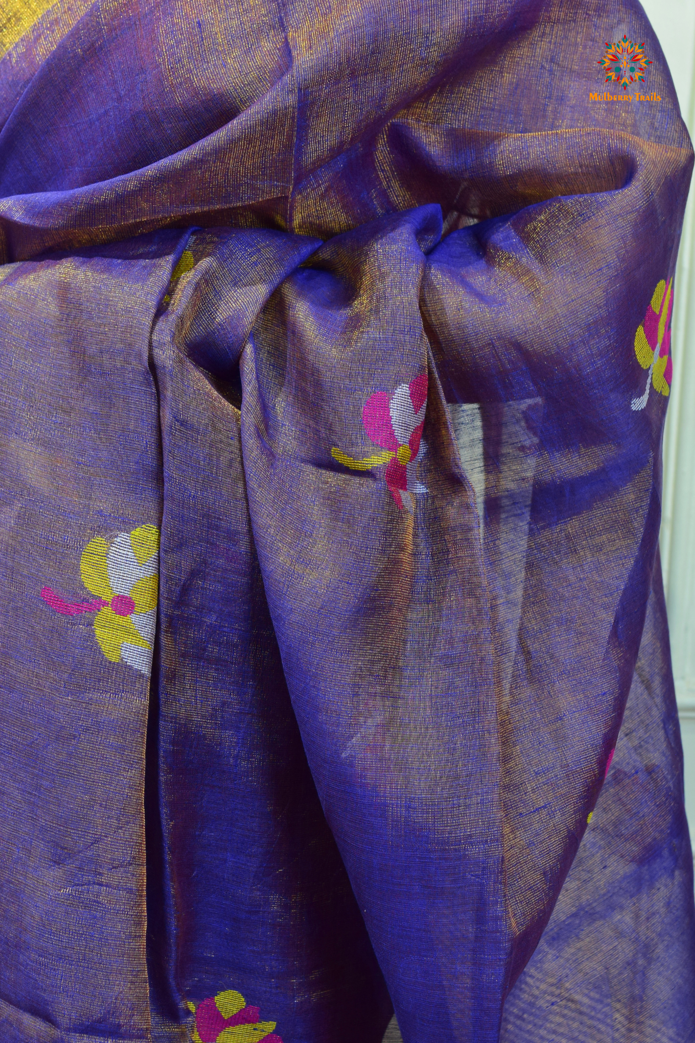 This image features an Elegant tissue saree featuring intricate handwoven Jamdani lotus motifs, with a lightweight, shimmery fabric that drapes beautifully, perfect for festive and special occasions. Party wear , diwali theme.