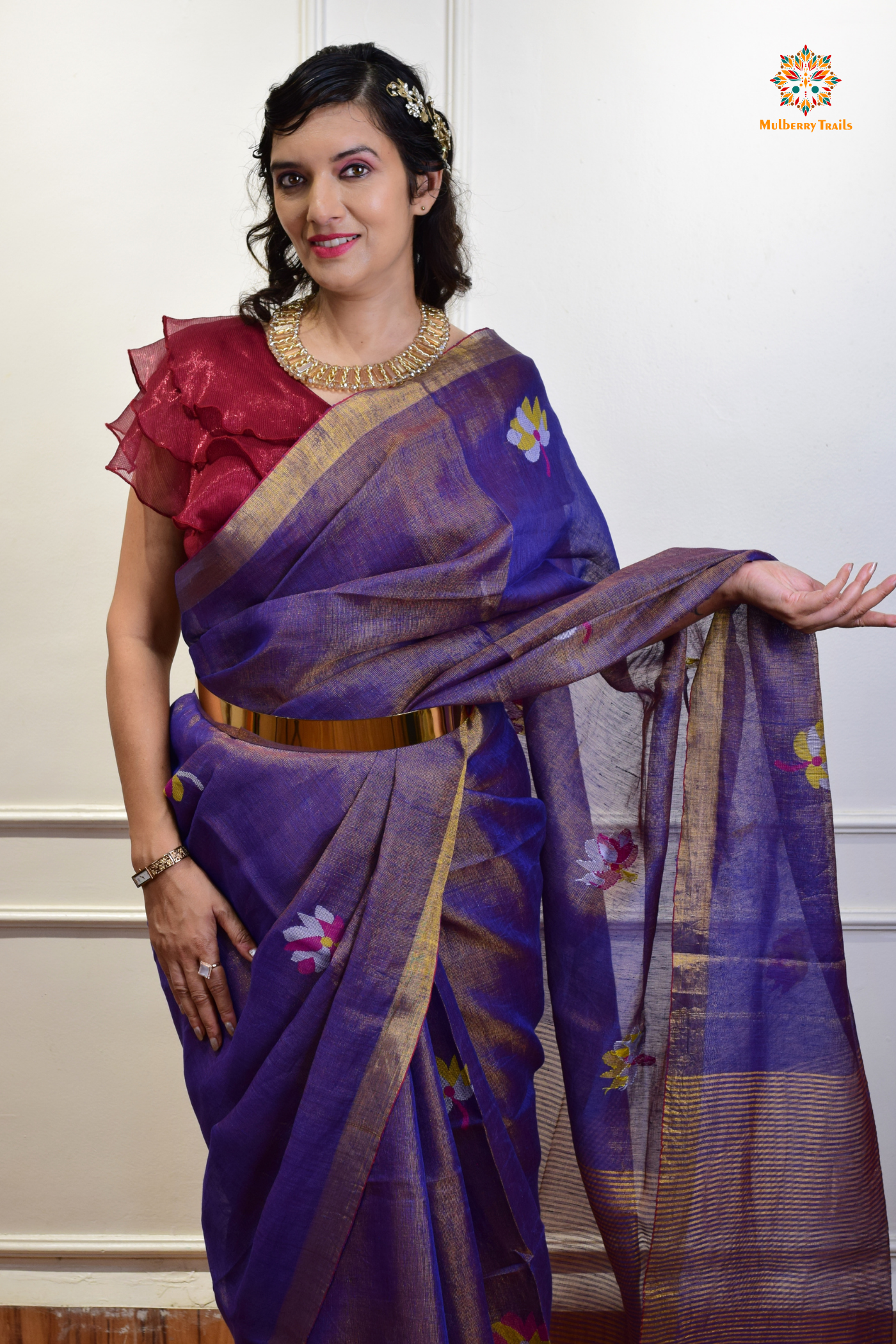This image features an Elegant tissue saree featuring intricate handwoven Jamdani lotus motifs, with a lightweight, shimmery fabric that drapes beautifully, perfect for festive and special occasions. Party wear , diwali theme.