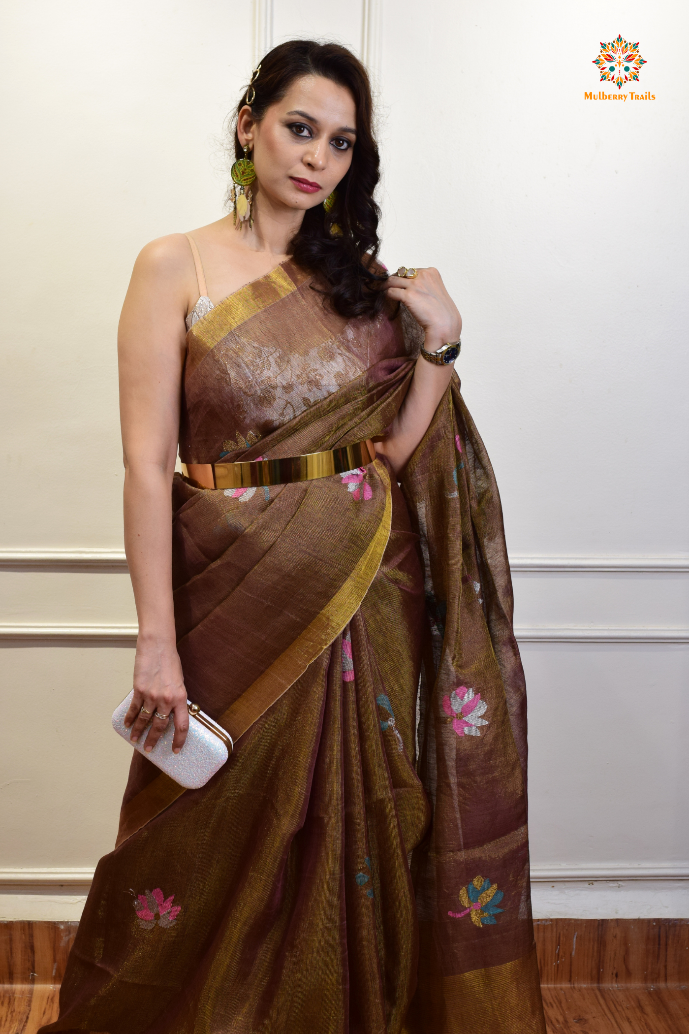 This image features an Elegant tissue saree featuring intricate handwoven Jamdani lotus motifs, with a lightweight, shimmery fabric that drapes beautifully, perfect for festive and special occasions. Party wear , diwali theme.