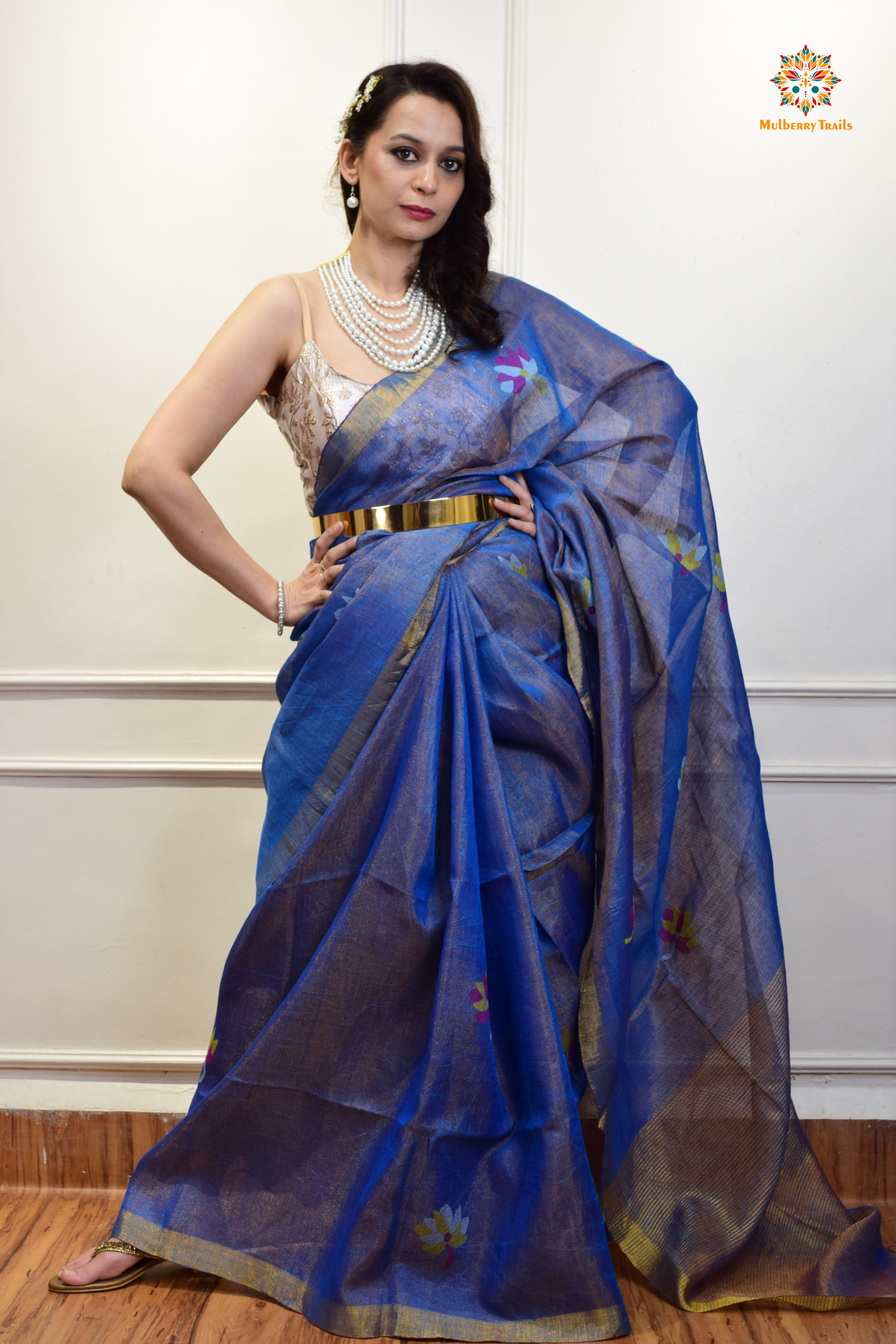 This image features an Elegant tissue saree featuring intricate handwoven Jamdani lotus motifs, with a lightweight, shimmery fabric that drapes beautifully, perfect for festive and special occasions. Party wear , diwali theme.