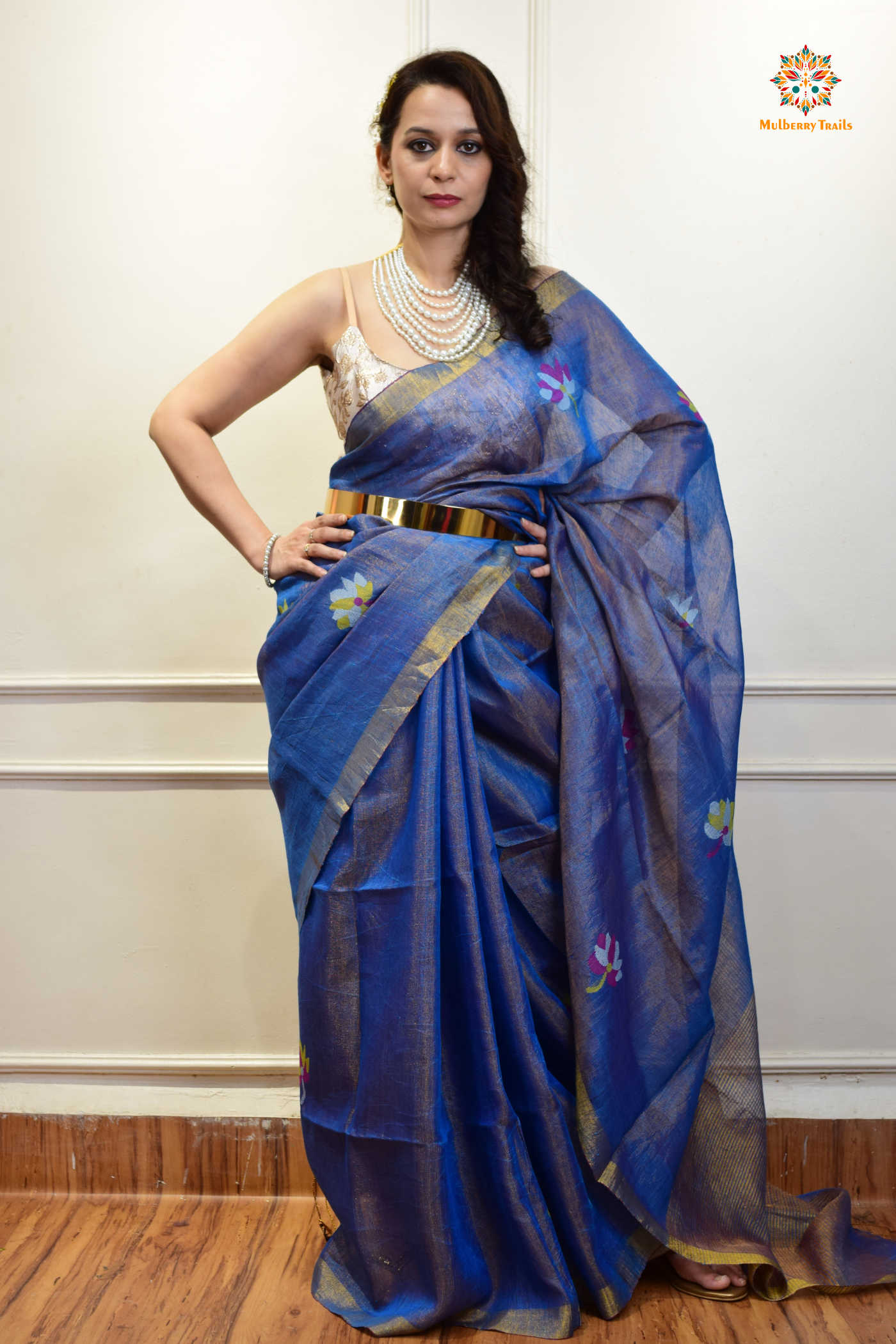 This image features an Elegant tissue saree featuring intricate handwoven Jamdani lotus motifs, with a lightweight, shimmery fabric that drapes beautifully, perfect for festive and special occasions. Party wear , diwali theme.