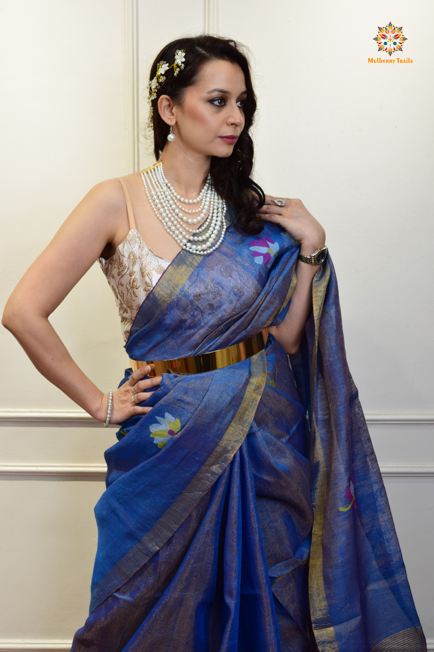 This image features an Elegant tissue saree featuring intricate handwoven Jamdani lotus motifs, with a lightweight, shimmery fabric that drapes beautifully, perfect for festive and special occasions. Party wear , diwali theme.