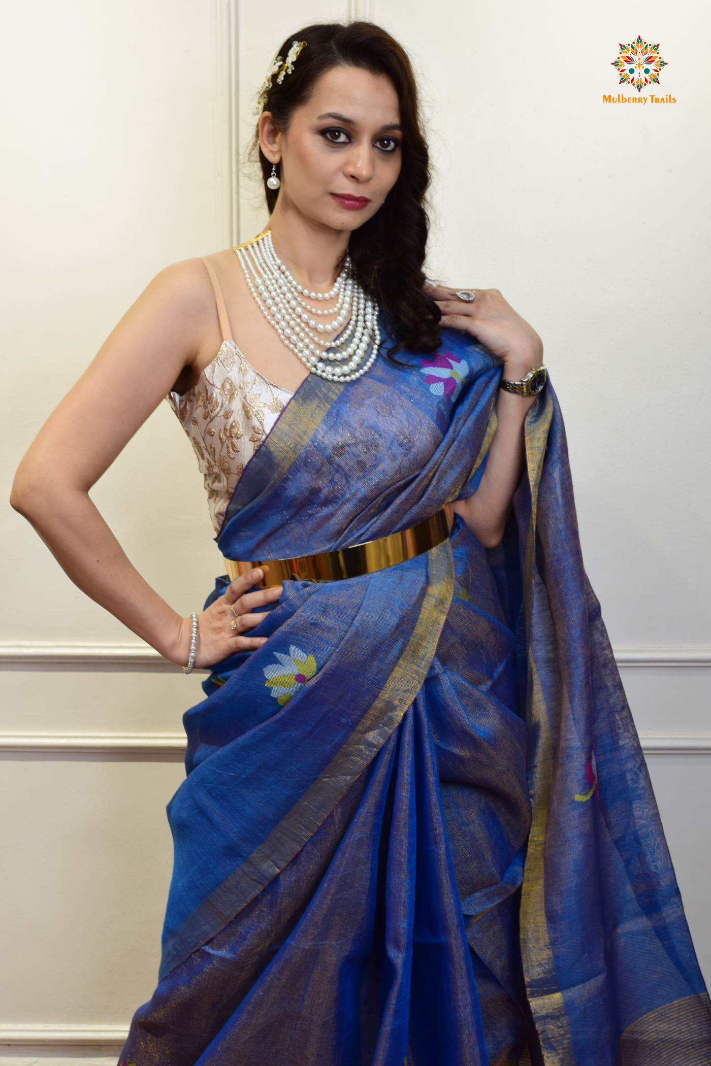 This image features an Elegant tissue saree featuring intricate handwoven Jamdani lotus motifs, with a lightweight, shimmery fabric that drapes beautifully, perfect for festive and special occasions. Party wear , diwali theme.