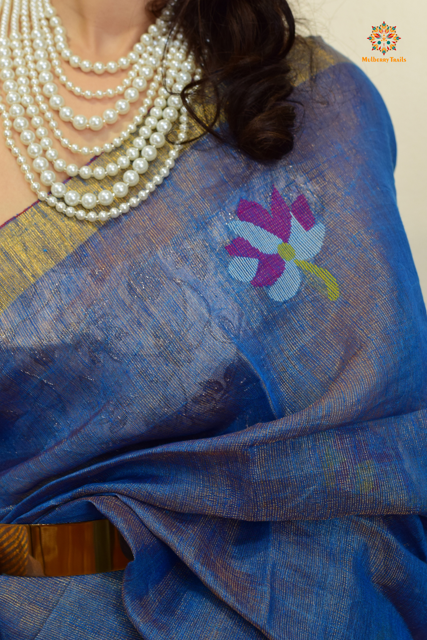 This image features an Elegant tissue saree featuring intricate handwoven Jamdani lotus motifs, with a lightweight, shimmery fabric that drapes beautifully, perfect for festive and special occasions. Party wear , diwali theme.
