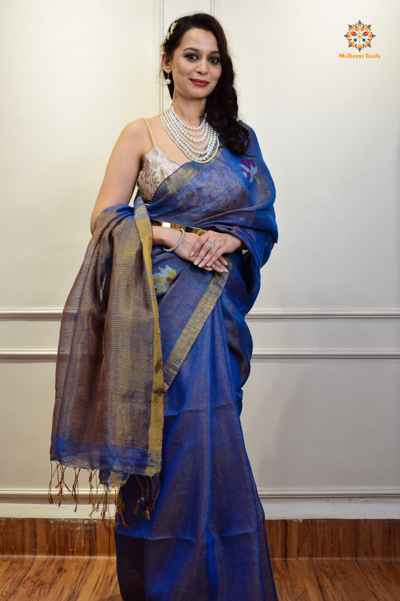 This image features an Elegant tissue saree featuring intricate handwoven Jamdani lotus motifs, with a lightweight, shimmery fabric that drapes beautifully, perfect for festive and special occasions. Party wear , diwali theme.