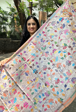 Elegant pure silk dupatta in beige color, featuring intricate Kantha embroidery with vibrant floral and paisley motifs. The dupatta boasts a luxurious sheen and a rich texture, perfect for adding a touch of sophistication to any outfit. The hand-embroidered details highlight the traditional craftsmanship and artistry, making it a statement accessory for festive occasions or special events.