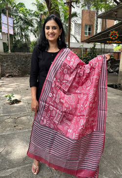 Elegant pure silk dupatta in Mauve color, featuring intricate Warli Kantha embroidery with vibrant floral and paisley motifs. The dupatta boasts a luxurious sheen and a rich texture, perfect for adding a touch of sophistication to any outfit. The hand-embroidered details highlight the traditional craftsmanship and artistry, making it a statement accessory for festive occasions or special events.