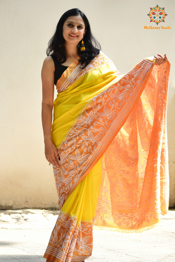 Art Silk saree with intricate Kantha embroidery featuring delicate floral and geometric patterns. The saree has a smooth, lightweight texture with vibrant threads that highlight the traditional hand-embroidery, adding a touch of elegance and cultural charm. Ideal for festive occasions, celebrations, or as a statement piece for special events.