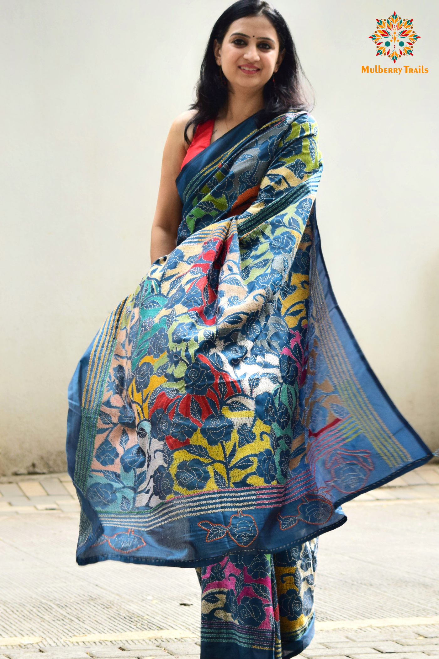 Art Silk saree with intricate Kantha embroidery featuring delicate floral and geometric patterns. The saree has a smooth, lightweight texture with vibrant threads that highlight the traditional hand-embroidery, adding a touch of elegance and cultural charm. Ideal for festive occasions, celebrations, or as a statement piece for special events.