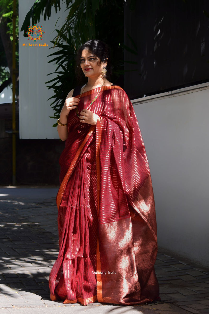 Premium saree for festivals, sophisticated saree, Luxury contemporary sari linen saree, handloom, stripes, tissue, unique copper zari work border, Model wearing Linen sari, Saree and blouse combination, saree for friends wedding, saree for wedding gift, saree for festive wear, sari for ganpati occassion, saree for diwali, luxurious handwoven linen sarees with modern copper zari 