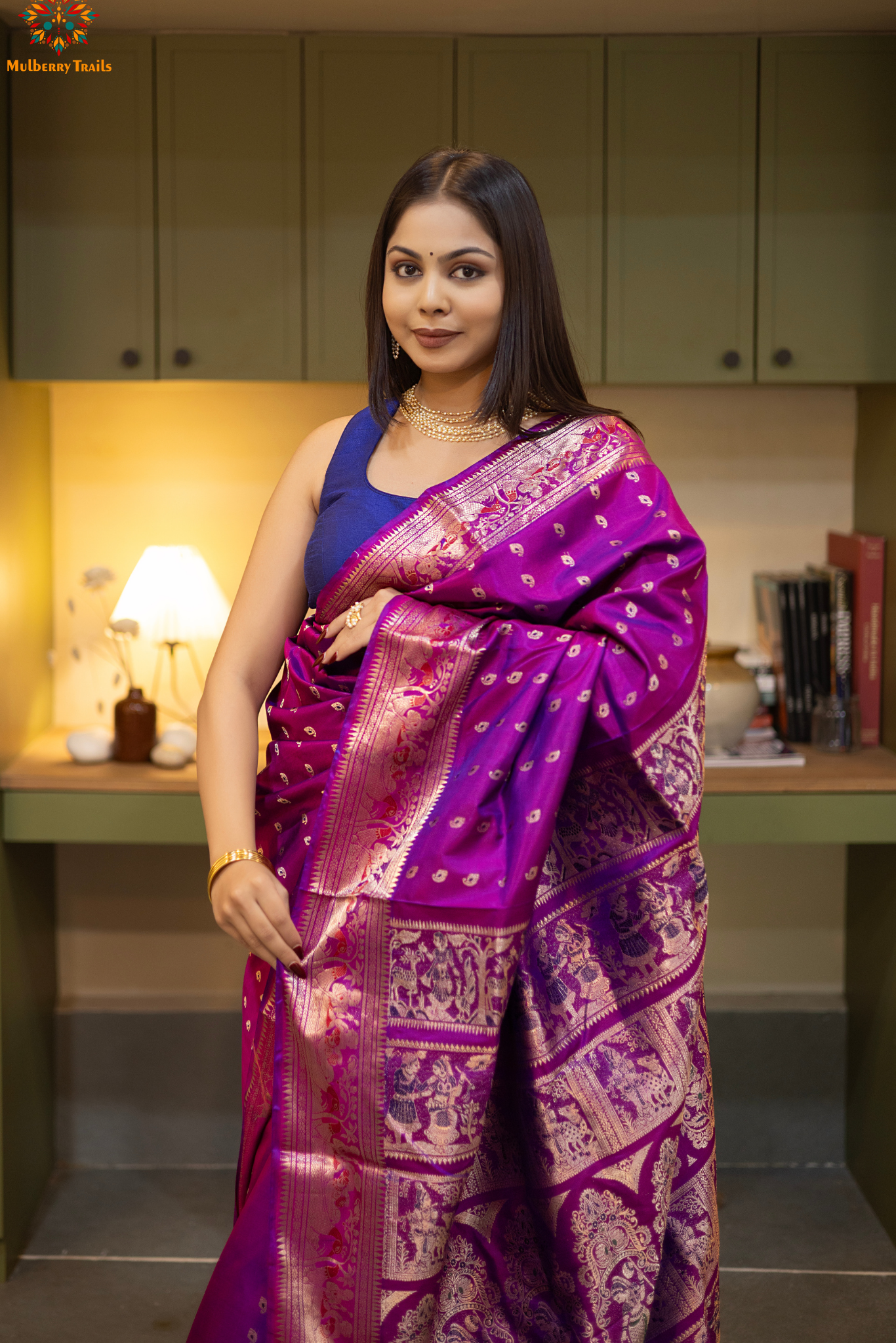 Woman wearing a purple saree with a pattern in a room. Woman in a pink saree standing in a elegant setting. 
Swarnachari – Pure Silk Hazarbutta Saree

1. “Pure silk Swarnachari saree with hazarbutta thousand-motif weave and copper zari detailing for a regal look.”

2. “Silk Mark pure silk hazarbutta saree featuring intricate copper zari motifs and rich texture.” 
Woman wearing a black and copper zari saree in a room with a desk and lamp.