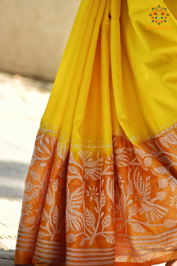 Art Silk saree with intricate Kantha embroidery featuring delicate floral and geometric patterns. The saree has a smooth, lightweight texture with vibrant threads that highlight the traditional hand-embroidery, adding a touch of elegance and cultural charm. Ideal for festive occasions, celebrations, or as a statement piece for special events.