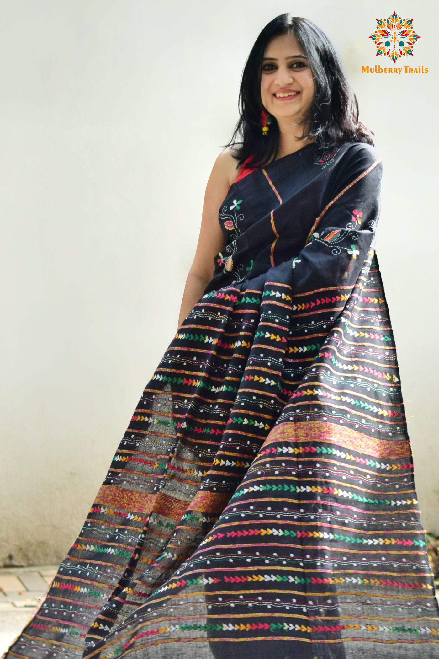 Elegant cotton saree from the Vipas collection, featuring intricate Kantha embroidery with detailed floral and abstract motifs. The saree is crafted from soft, breathable cotton, offering comfort and style. The hand-embroidered patterns in vibrant hues add a touch of tradition and sophistication, perfect for everyday wear, office attire, or casual gatherings.