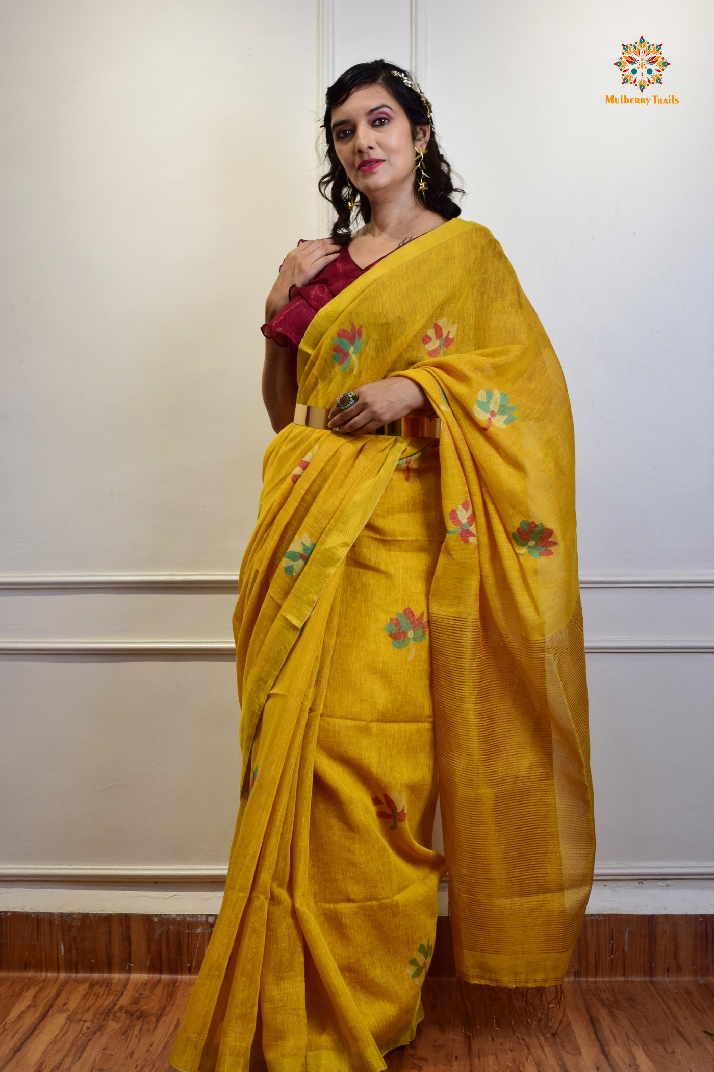 This image features an Elegant tissue saree featuring intricate handwoven Jamdani lotus motifs, with a lightweight, shimmery fabric that drapes beautifully, perfect for festive and special occasions. Party wear , diwali theme. 