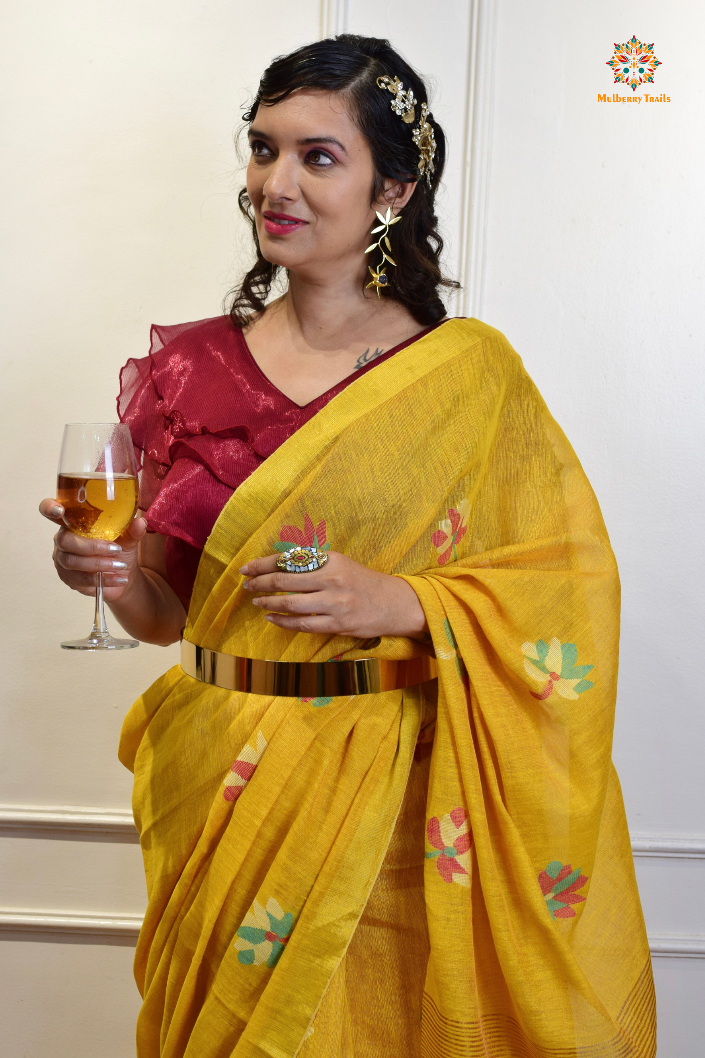 This image features an Elegant tissue saree featuring intricate handwoven Jamdani lotus motifs, with a lightweight, shimmery fabric that drapes beautifully, perfect for festive and special occasions. Party wear , diwali theme. 