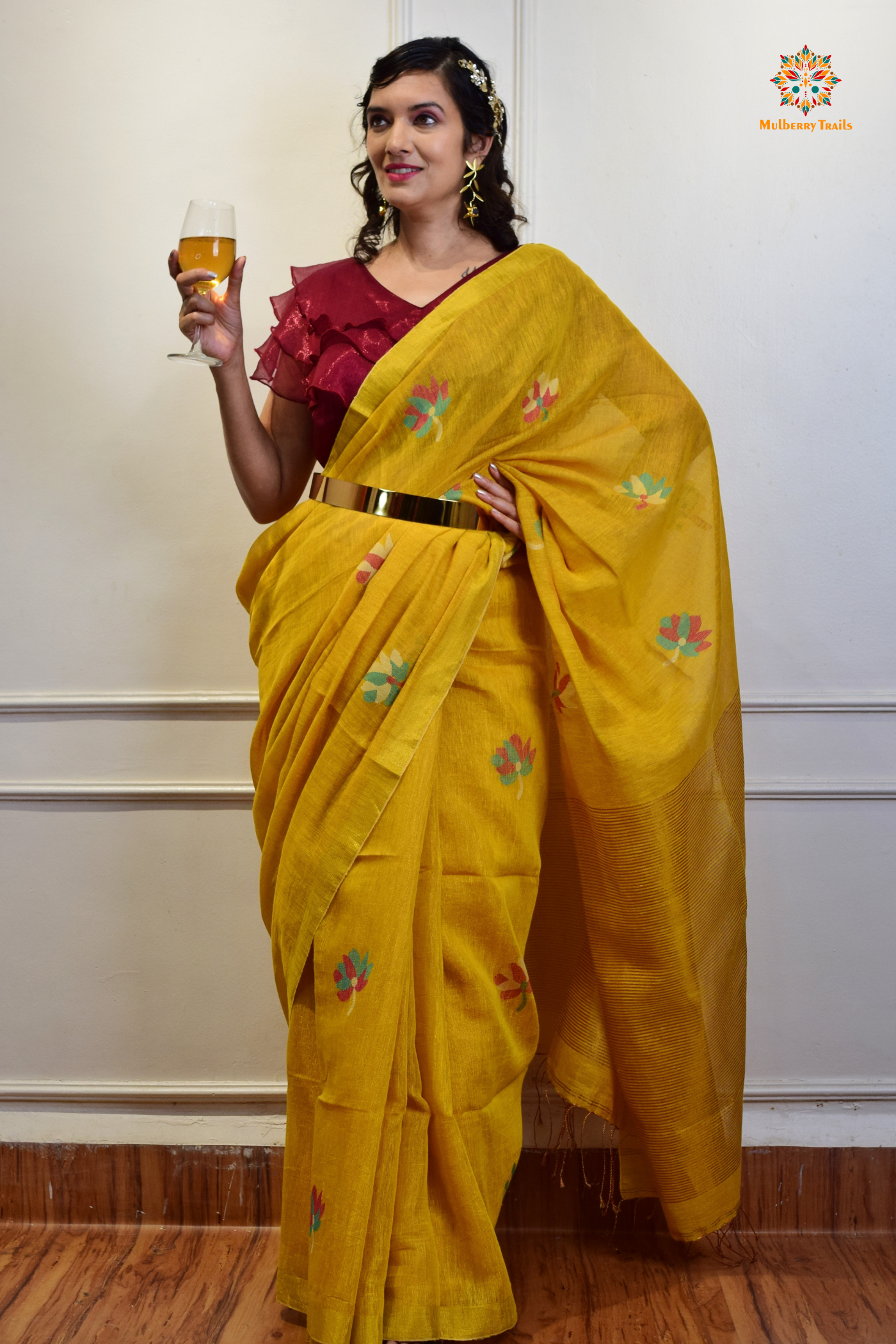 This image features an Elegant tissue saree featuring intricate handwoven Jamdani lotus motifs, with a lightweight, shimmery fabric that drapes beautifully, perfect for festive and special occasions. Party wear , diwali theme. 