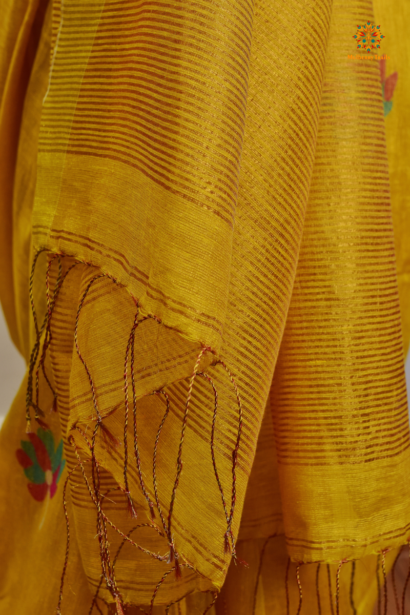 This image features an Elegant tissue saree featuring intricate handwoven Jamdani lotus motifs, with a lightweight, shimmery fabric that drapes beautifully, perfect for festive and special occasions. Party wear , diwali theme. 