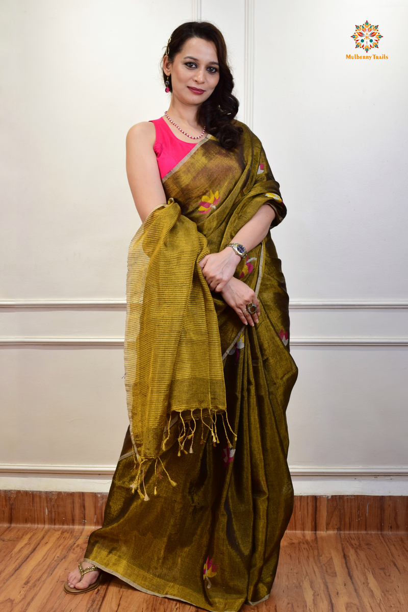 This image features an Elegant tissue saree featuring intricate handwoven Jamdani lotus motifs, with a lightweight, shimmery fabric that drapes beautifully, perfect for festive and special occasions. Party wear , diwali theme. 