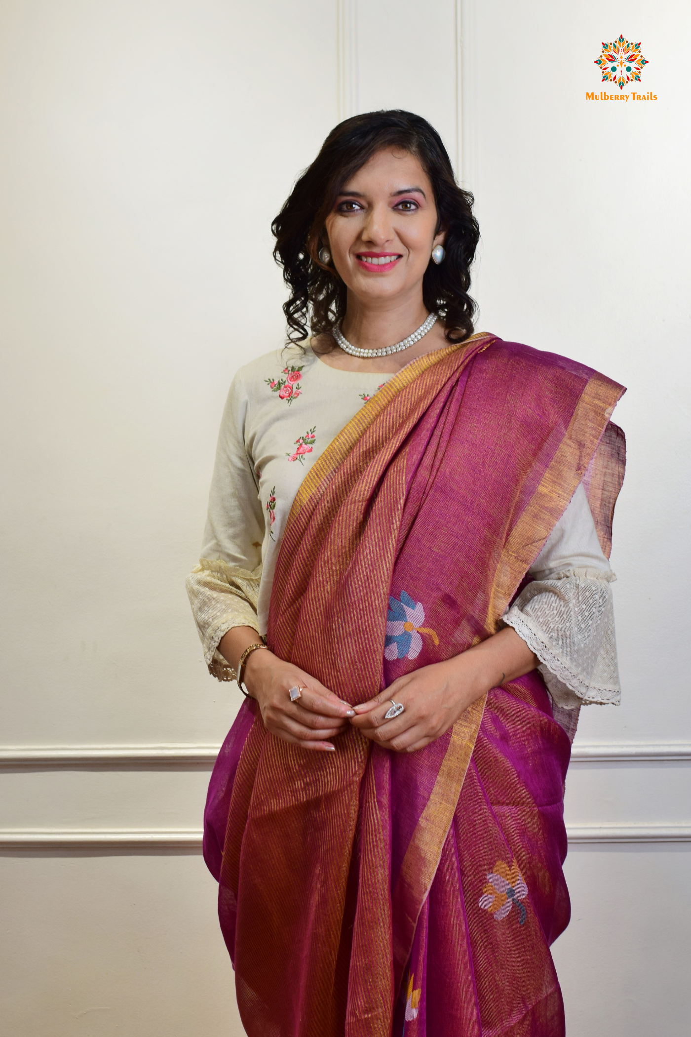 This image features an Elegant tissue saree featuring intricate handwoven Jamdani lotus motifs, with a lightweight, shimmery fabric that drapes beautifully, perfect for festive and special occasions. Party wear , diwali theme. 