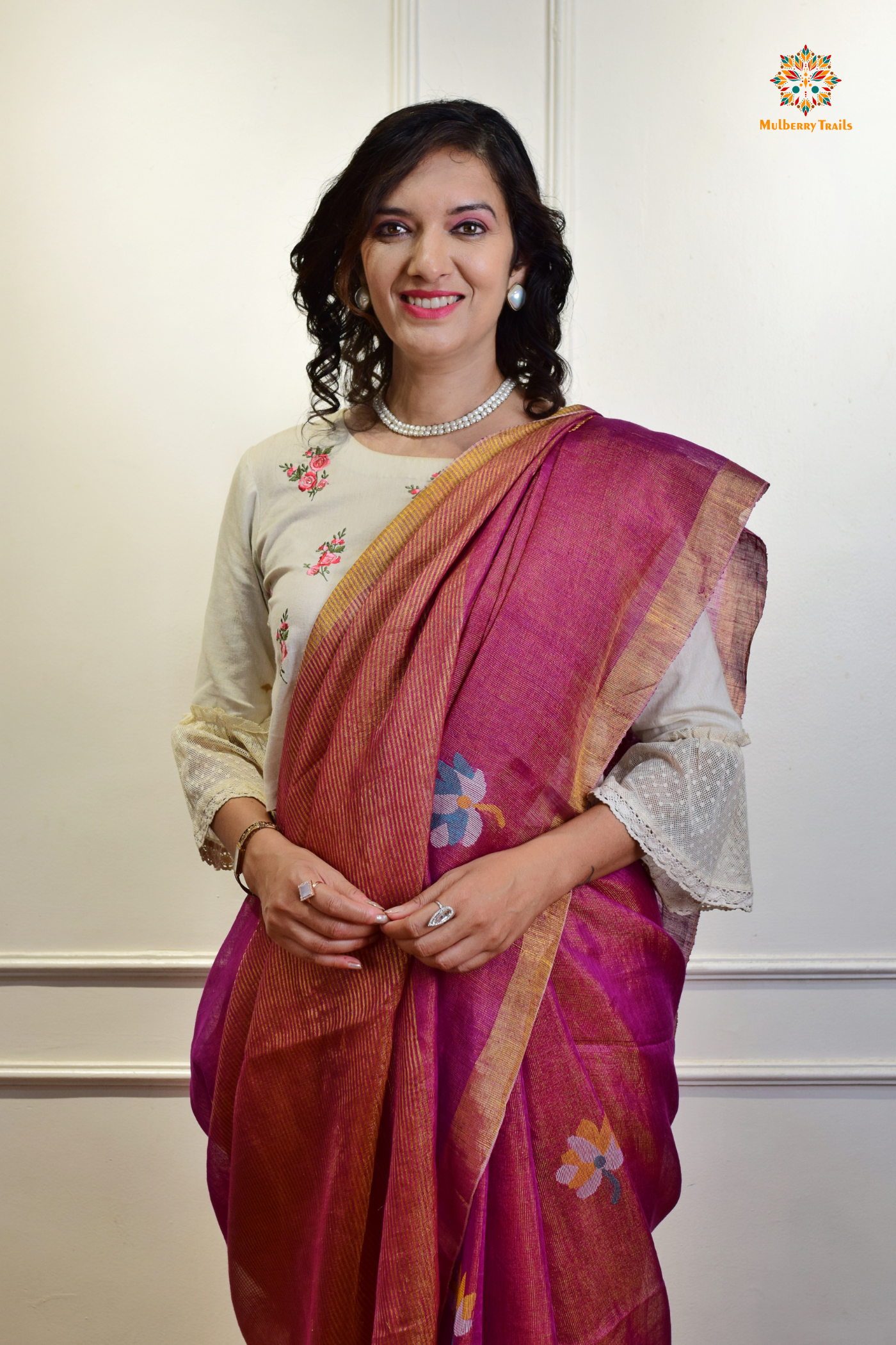 This image features an Elegant tissue saree featuring intricate handwoven Jamdani lotus motifs, with a lightweight, shimmery fabric that drapes beautifully, perfect for festive and special occasions. Party wear , diwali theme. 