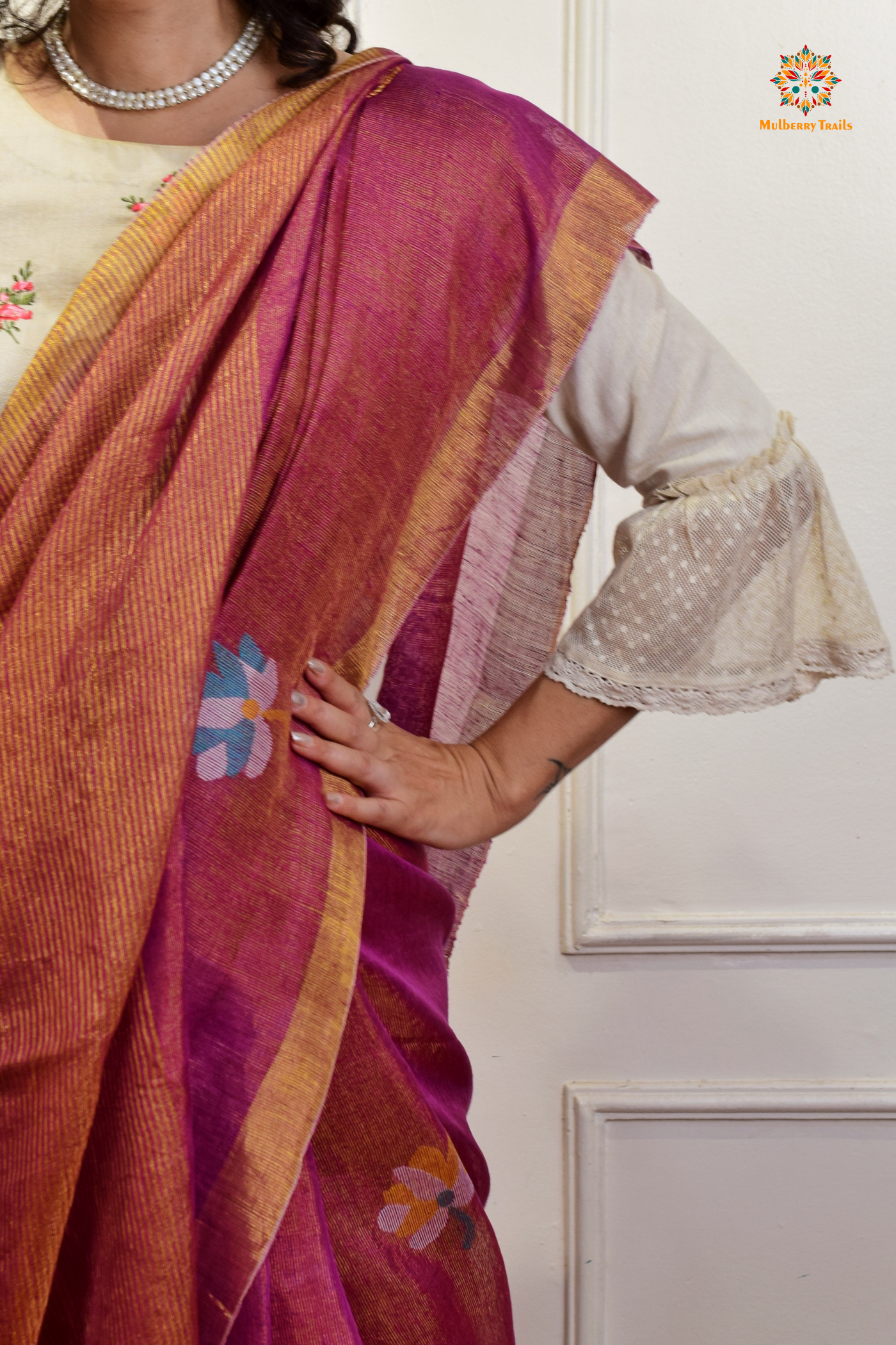 This image features an Elegant tissue saree featuring intricate handwoven Jamdani lotus motifs, with a lightweight, shimmery fabric that drapes beautifully, perfect for festive and special occasions. Party wear , diwali theme. 