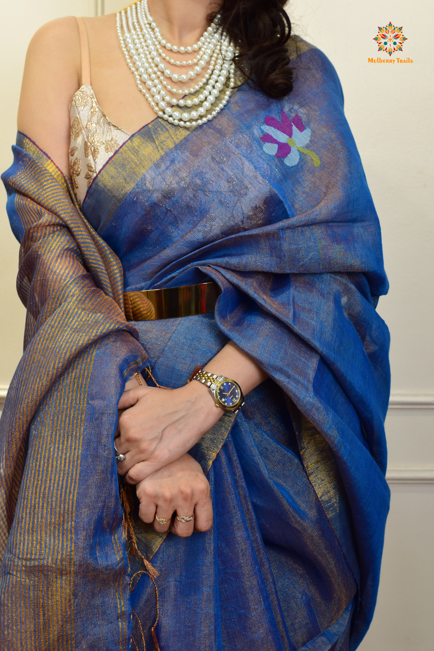 This image features an Elegant tissue saree featuring intricate handwoven Jamdani lotus motifs, with a lightweight, shimmery fabric that drapes beautifully, perfect for festive and special occasions. Party wear , diwali theme. 