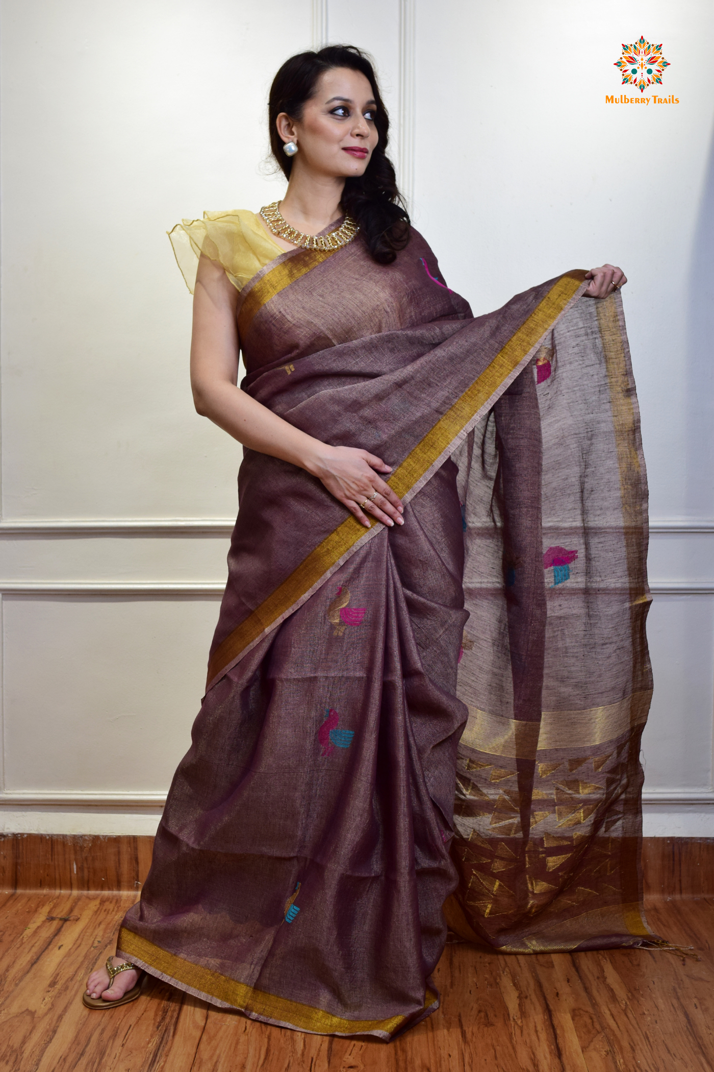 This image features an Elegant tissue saree featuring intricate handwoven Jamdani lotus motifs, with a lightweight, shimmery fabric that drapes beautifully, perfect for festive and special occasions. Party wear , diwali theme. 