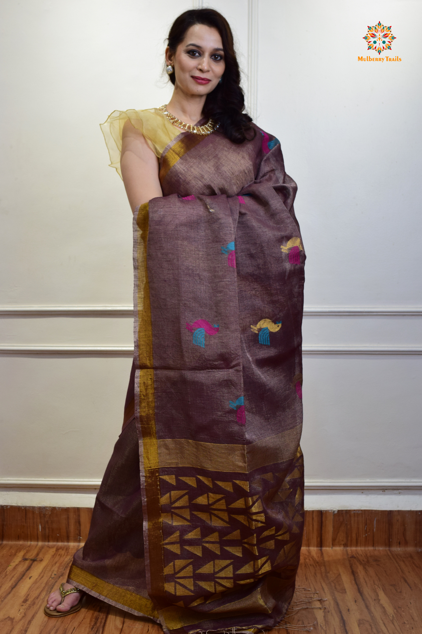 This image features an Elegant tissue saree featuring intricate handwoven Jamdani lotus motifs, with a lightweight, shimmery fabric that drapes beautifully, perfect for festive and special occasions. Party wear , diwali theme. 