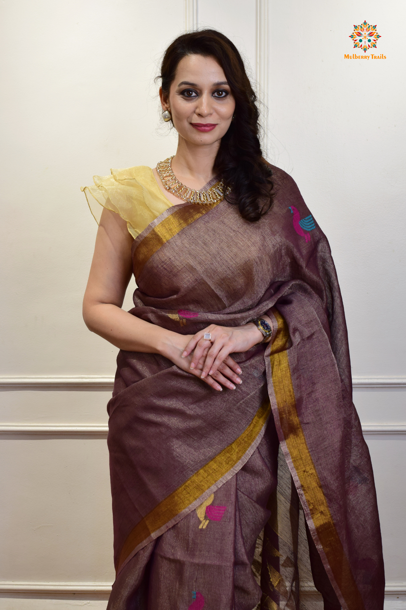 This image features an Elegant tissue saree featuring intricate handwoven Jamdani lotus motifs, with a lightweight, shimmery fabric that drapes beautifully, perfect for festive and special occasions. Party wear , diwali theme. 