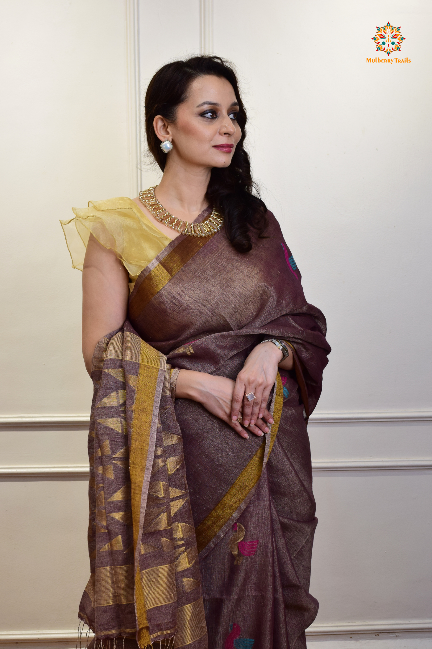 This image features an Elegant tissue saree featuring intricate handwoven Jamdani lotus motifs, with a lightweight, shimmery fabric that drapes beautifully, perfect for festive and special occasions. Party wear , diwali theme. 