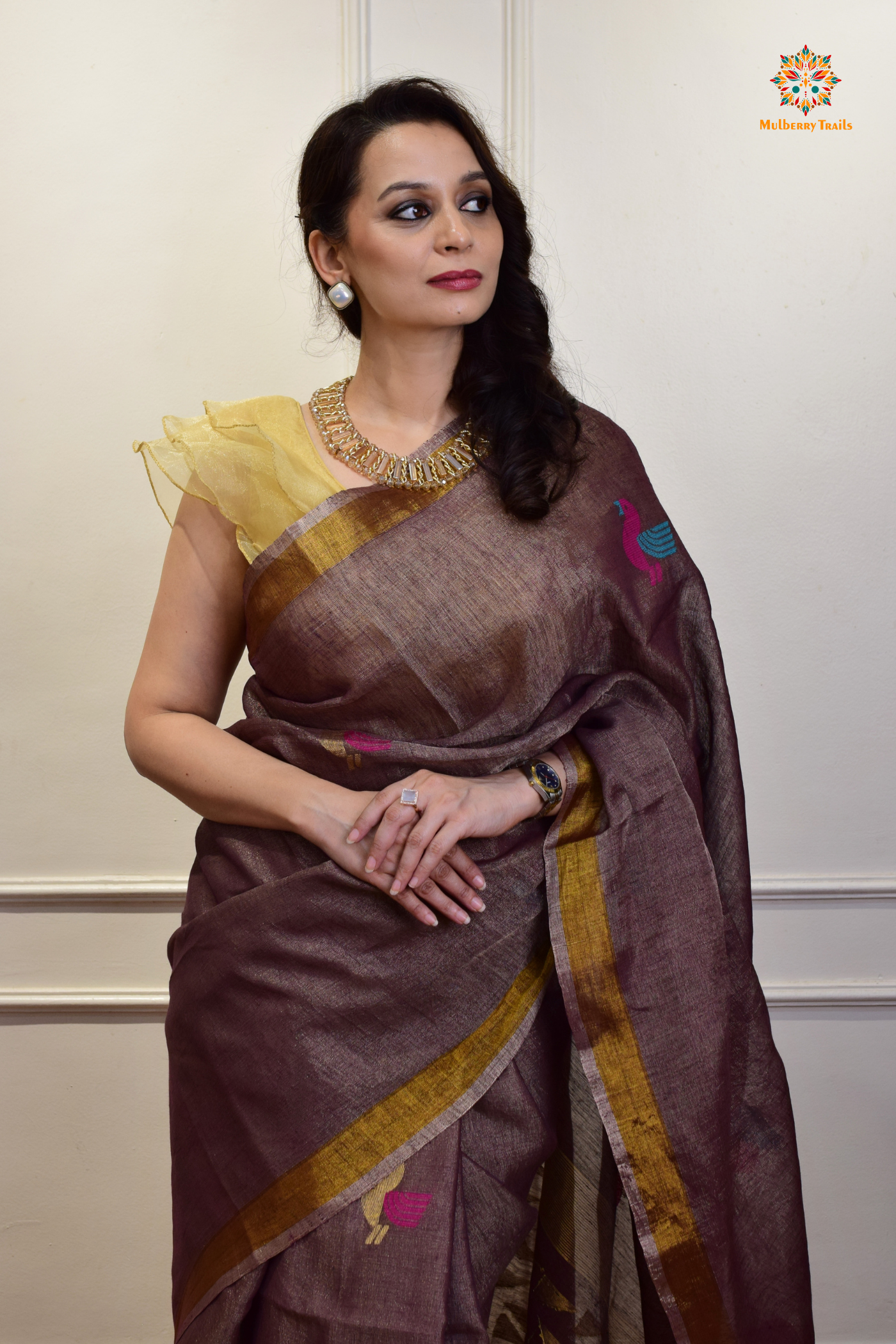 This image features an Elegant tissue saree featuring intricate handwoven Jamdani lotus motifs, with a lightweight, shimmery fabric that drapes beautifully, perfect for festive and special occasions. Party wear , diwali theme. 