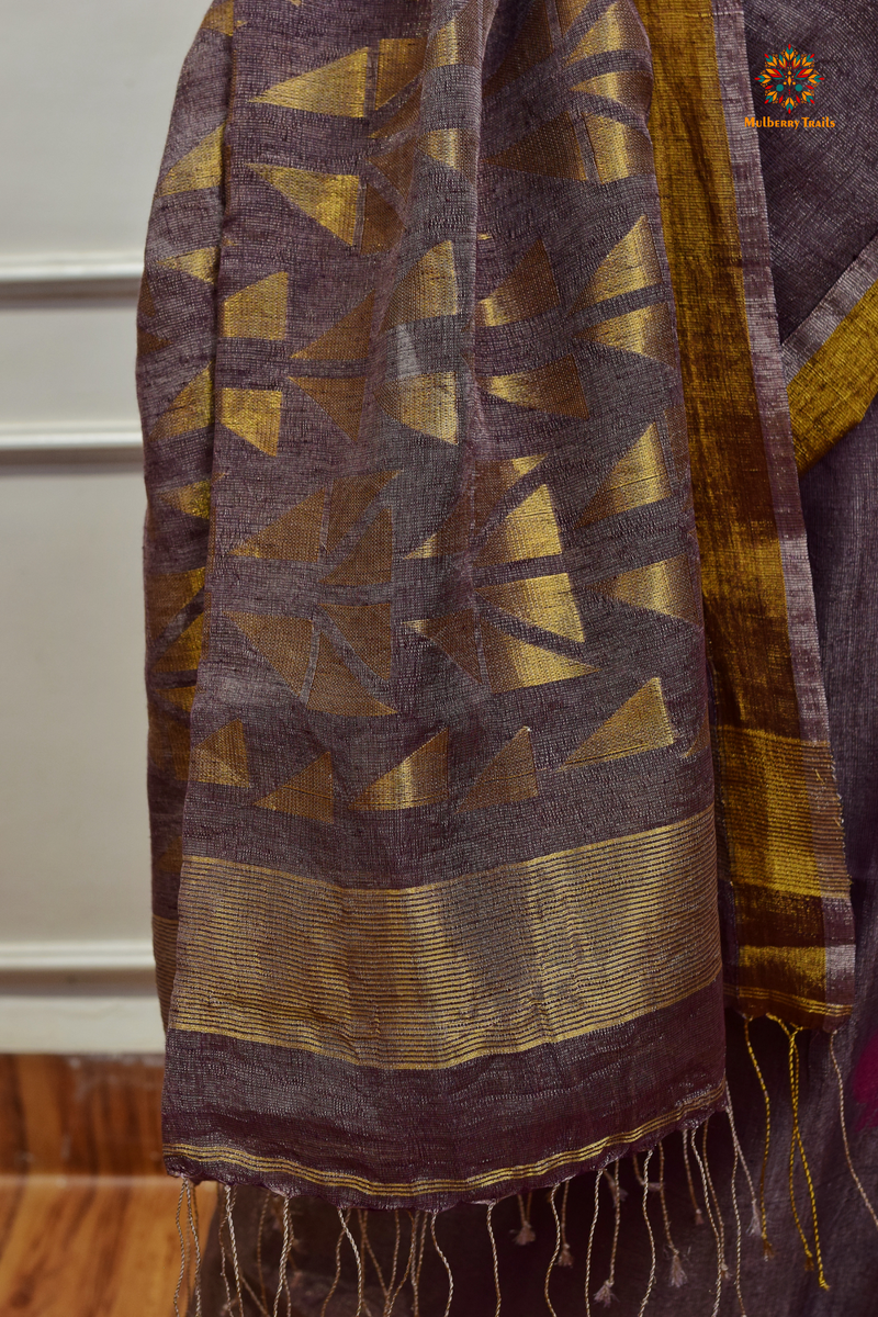 This image features an Elegant tissue saree featuring intricate handwoven Jamdani lotus motifs, with a lightweight, shimmery fabric that drapes beautifully, perfect for festive and special occasions. Party wear , diwali theme. 